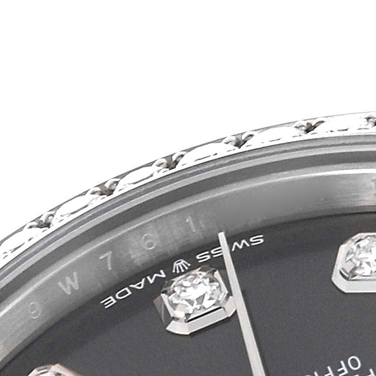 This image shows a close-up of the bezel, part of the dial, and diamond indices of a Rolex President 278289 Women's White Gold Grey Dial 278289 Women's White Gold Grey Dial model watch.