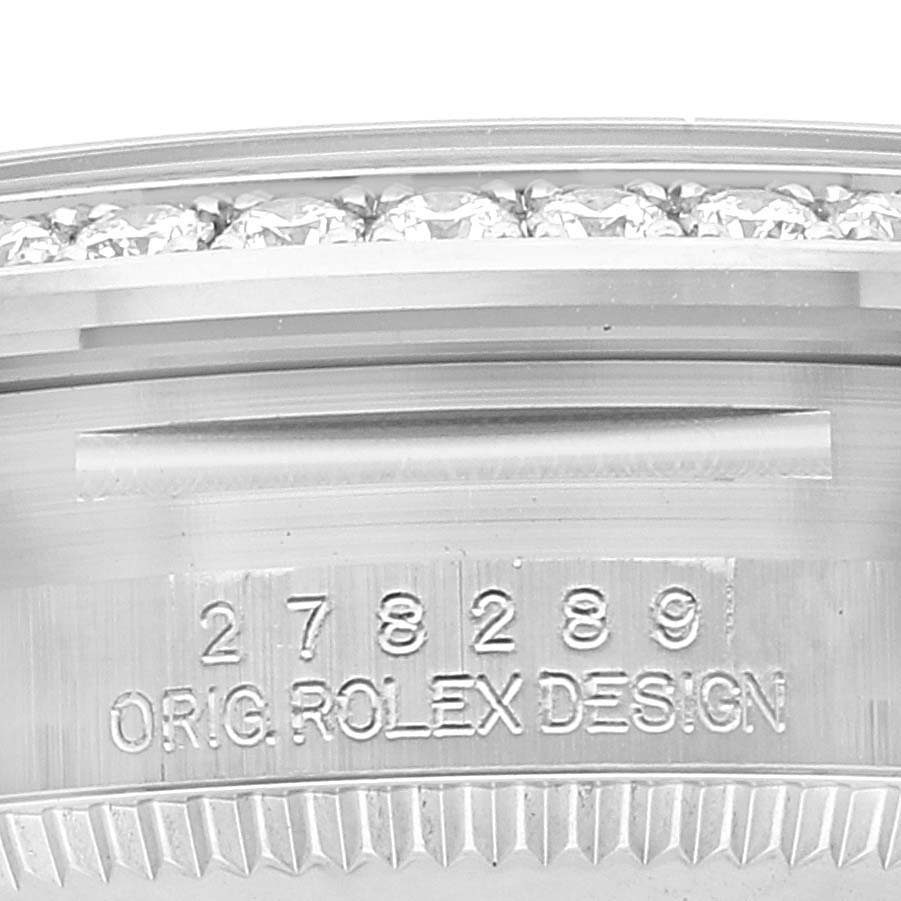 This close-up image shows the side engraving and diamond-set bezel of the Rolex President 278289 Women's White Gold Grey Dial 278289 Women's White Gold Grey Dial model.