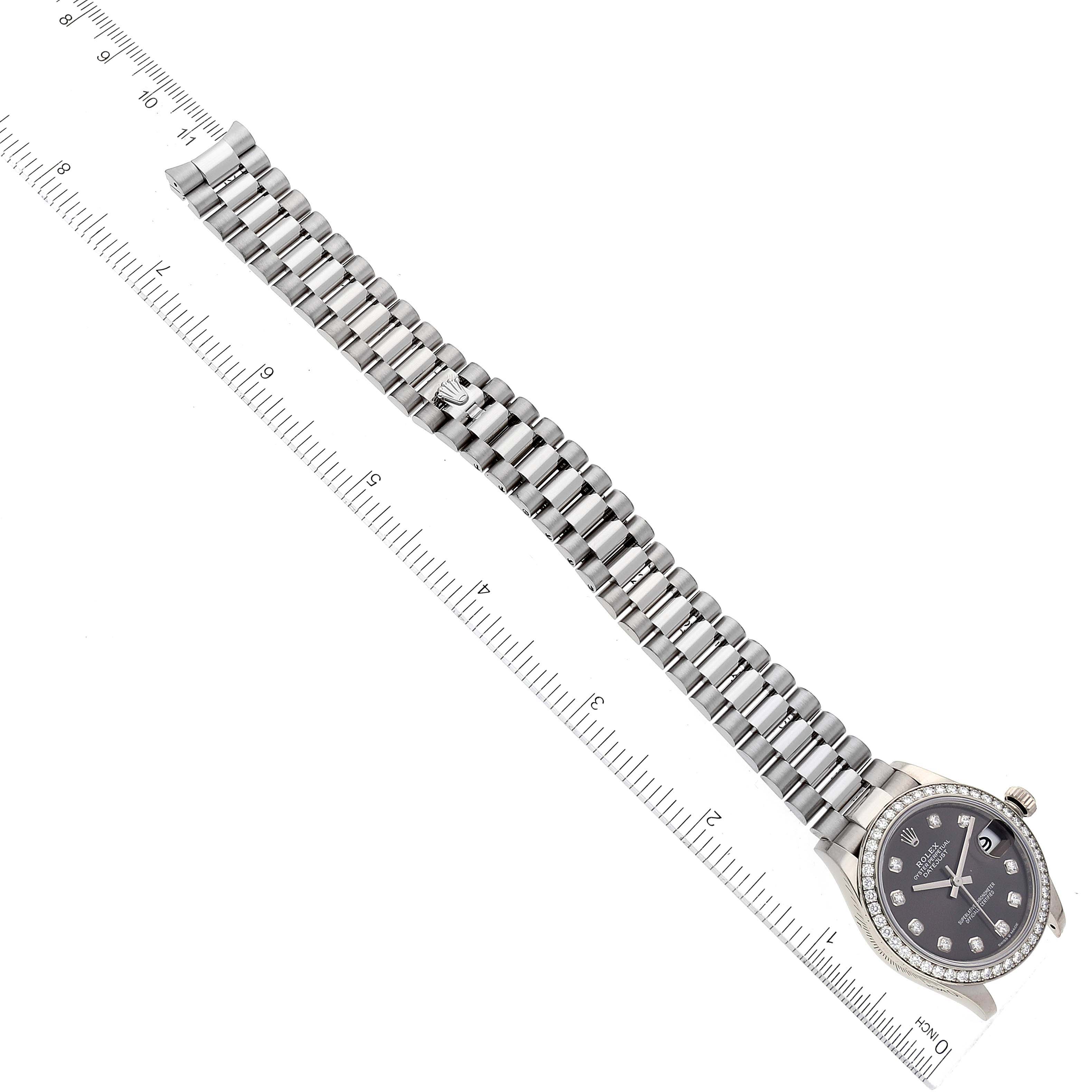 The image shows a Rolex President 278289 Women's White Gold Grey Dial 278289 Women's White Gold Grey Dial model watch laid flat, displaying a full view of the band and dial, alongside a measuring ruler for scale.
