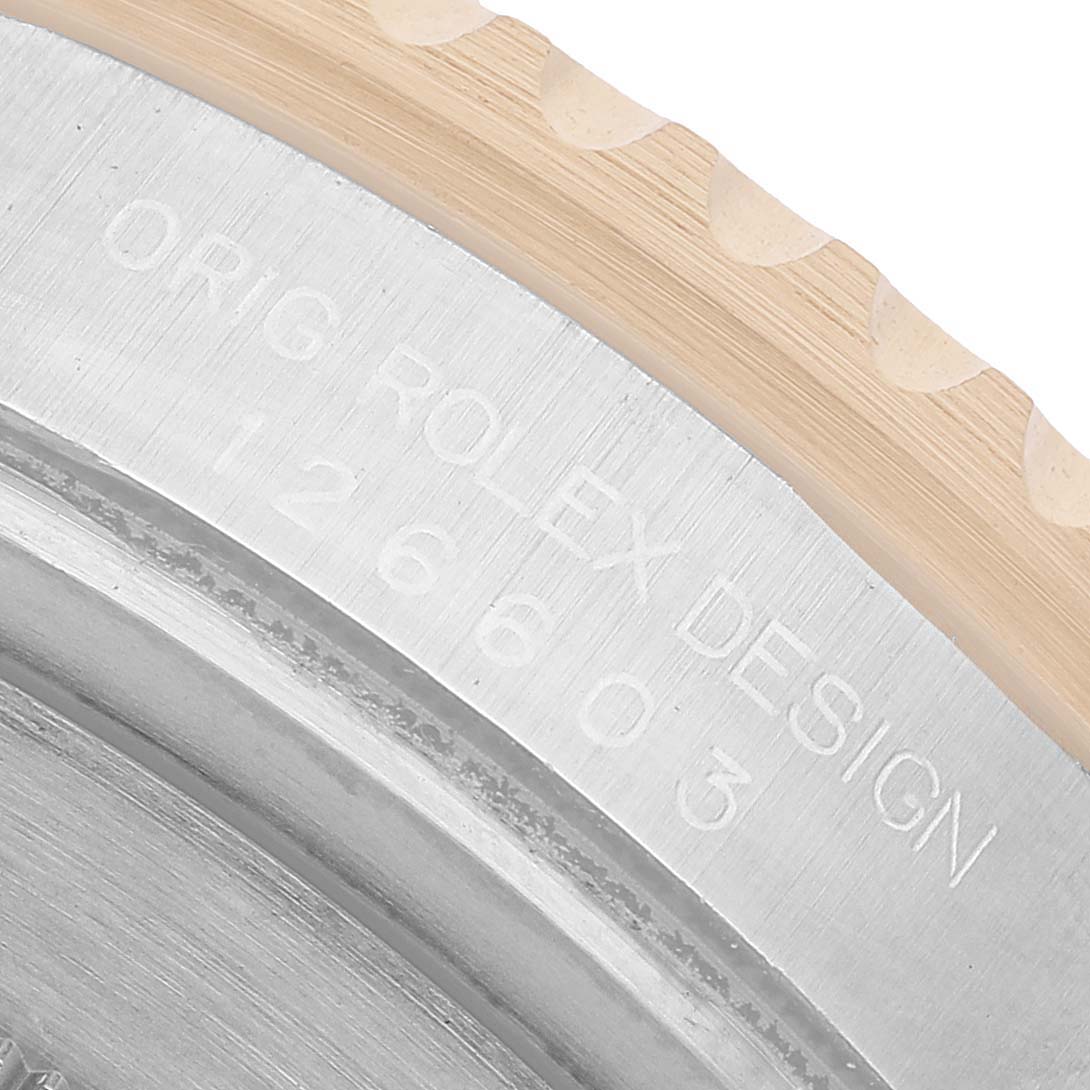 The image shows a close-up of the Rolex Sea-Dweller 126603 Men's Stainless Steel Black Dial's case side with engraved model details.