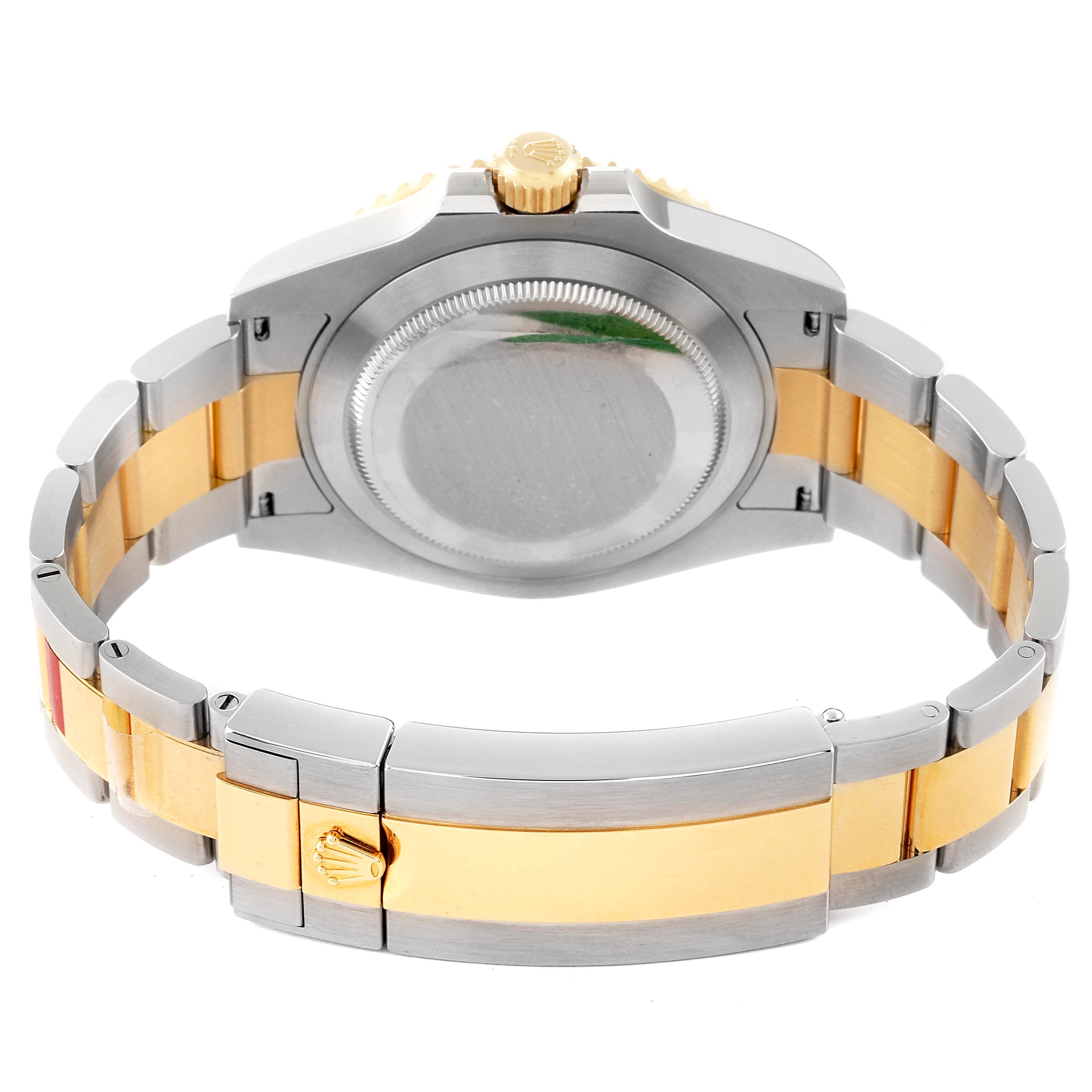 The image shows the back case, crown, and bracelet of the Rolex Submariner 126613 Men's Steel and Gold (two tone) Black Dial 126613 Men's Steel and Gold (two tone) Black Dial watch at a rear angle.