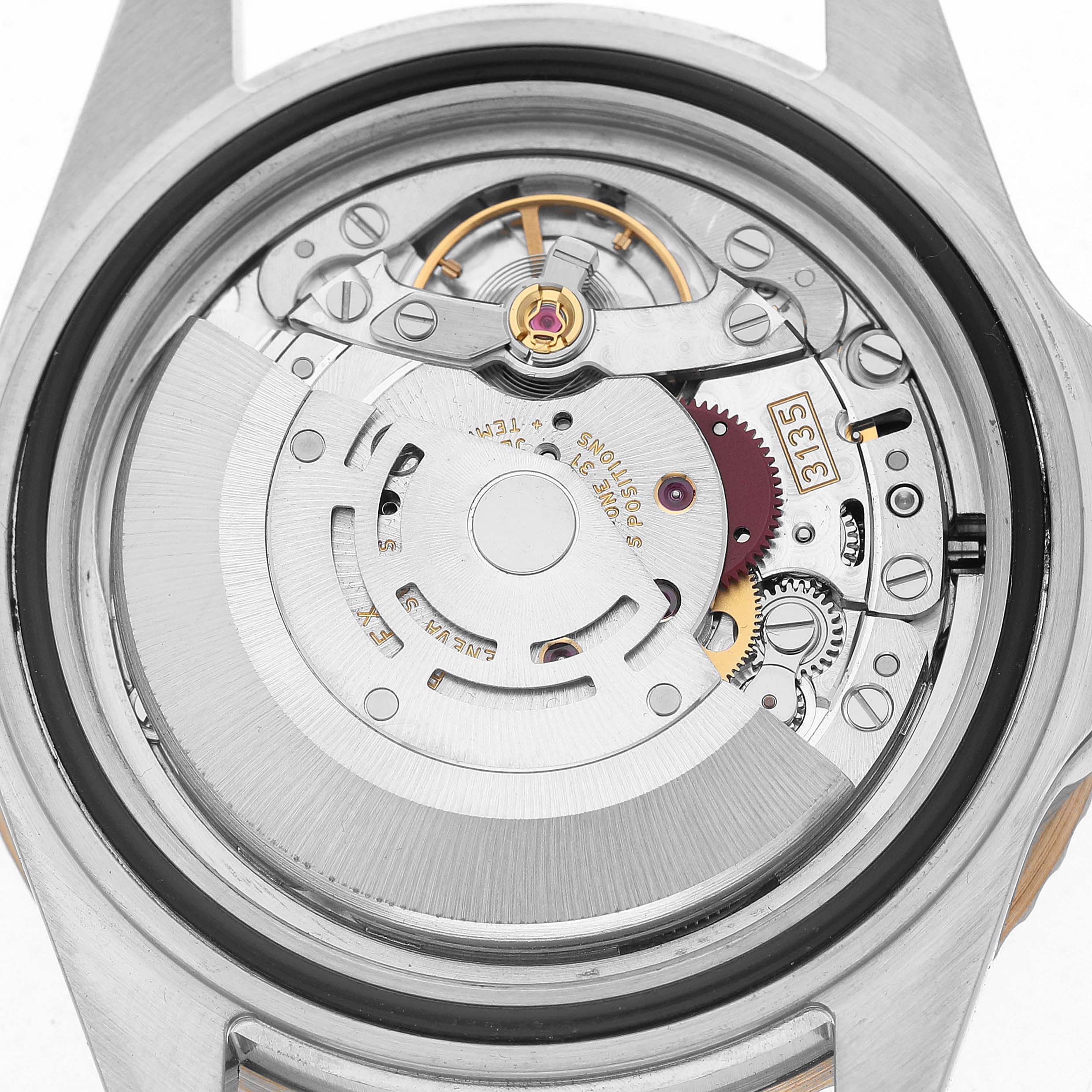 The image shows a close-up of a Rolex Submariner 16613 Men's Steel and Gold (two tone) Black Dial's movement, highlighting its intricate gears and components.