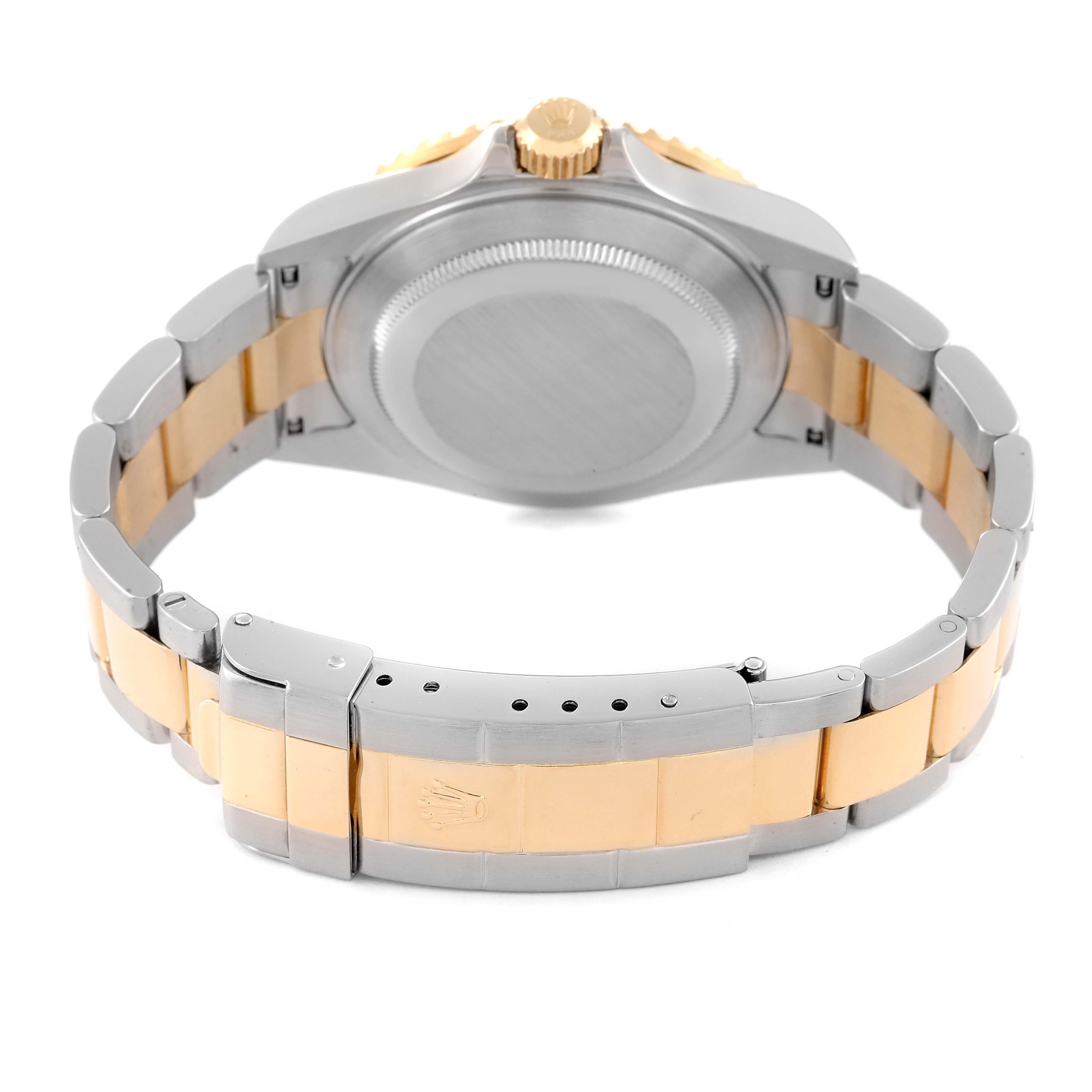 The image shows the back view of a Rolex Submariner 16613 Men's Steel and Gold (two tone) Black Dial 16613 Men's Steel and Gold (two tone) Black Dial watch, displaying its case back and two-tone bracelet with a clasp.