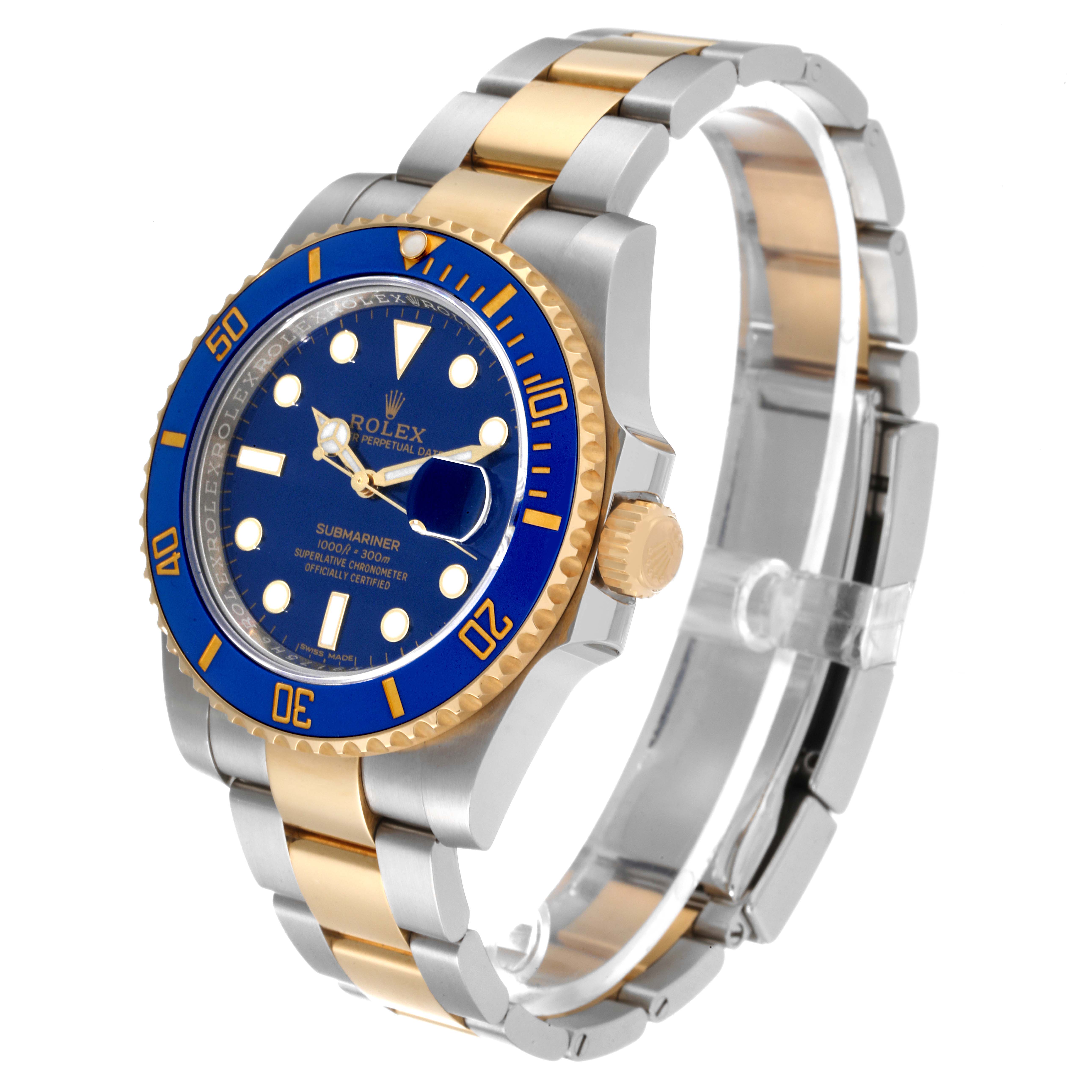 The image shows a Rolex Submariner 116613 Men's Steel and Gold (two tone) Blue Dial 116613 Men's Steel and Gold (two tone) Blue Dial watch with a blue dial and bezel, two-tone bracelet, and gold crown, angled to display the face and band.