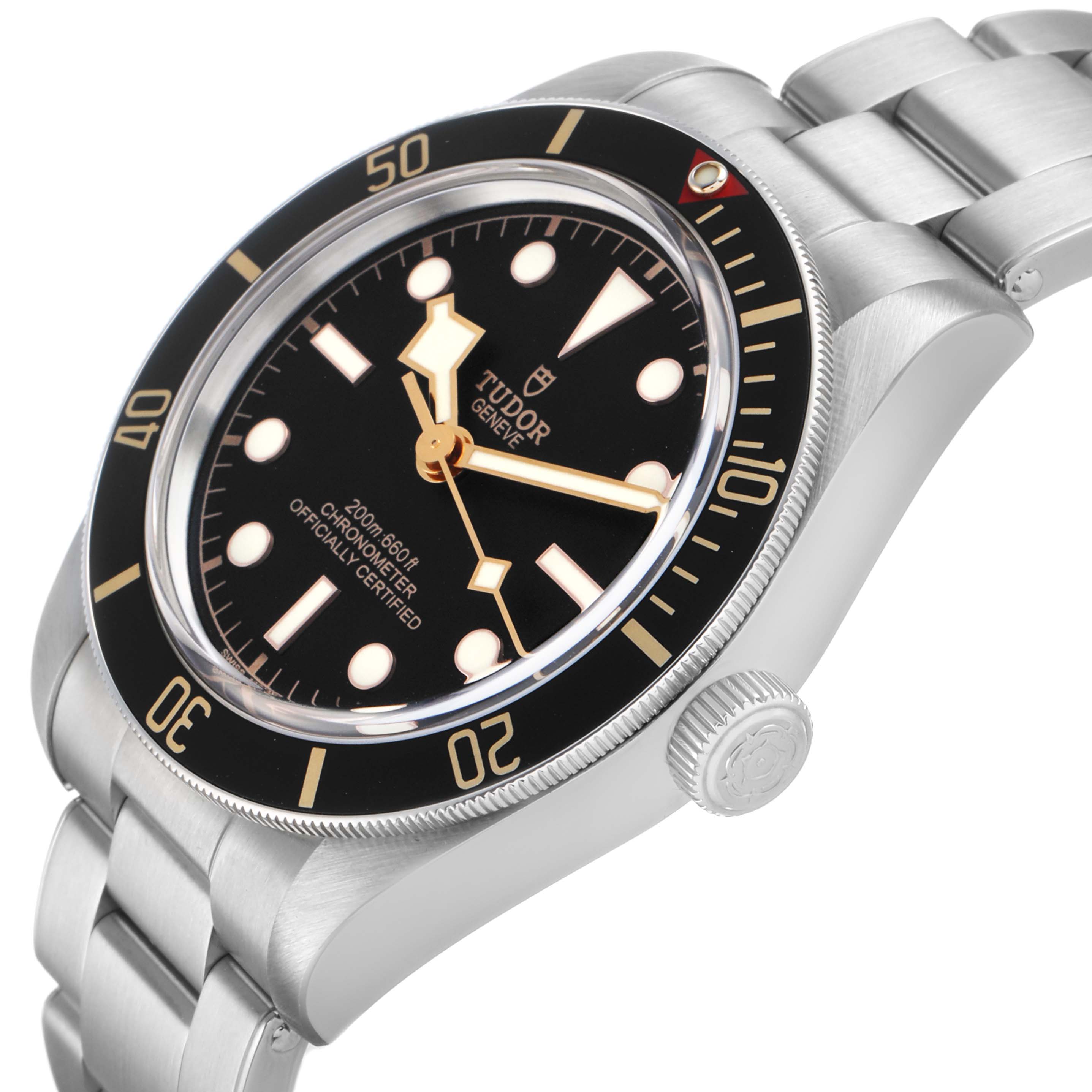 The Tudor Heritage Black Bay 79030 Men's Stainless Steel Black Dial watch is shown from a side angle, highlighting the bezel, dial, crown, and bracelet.