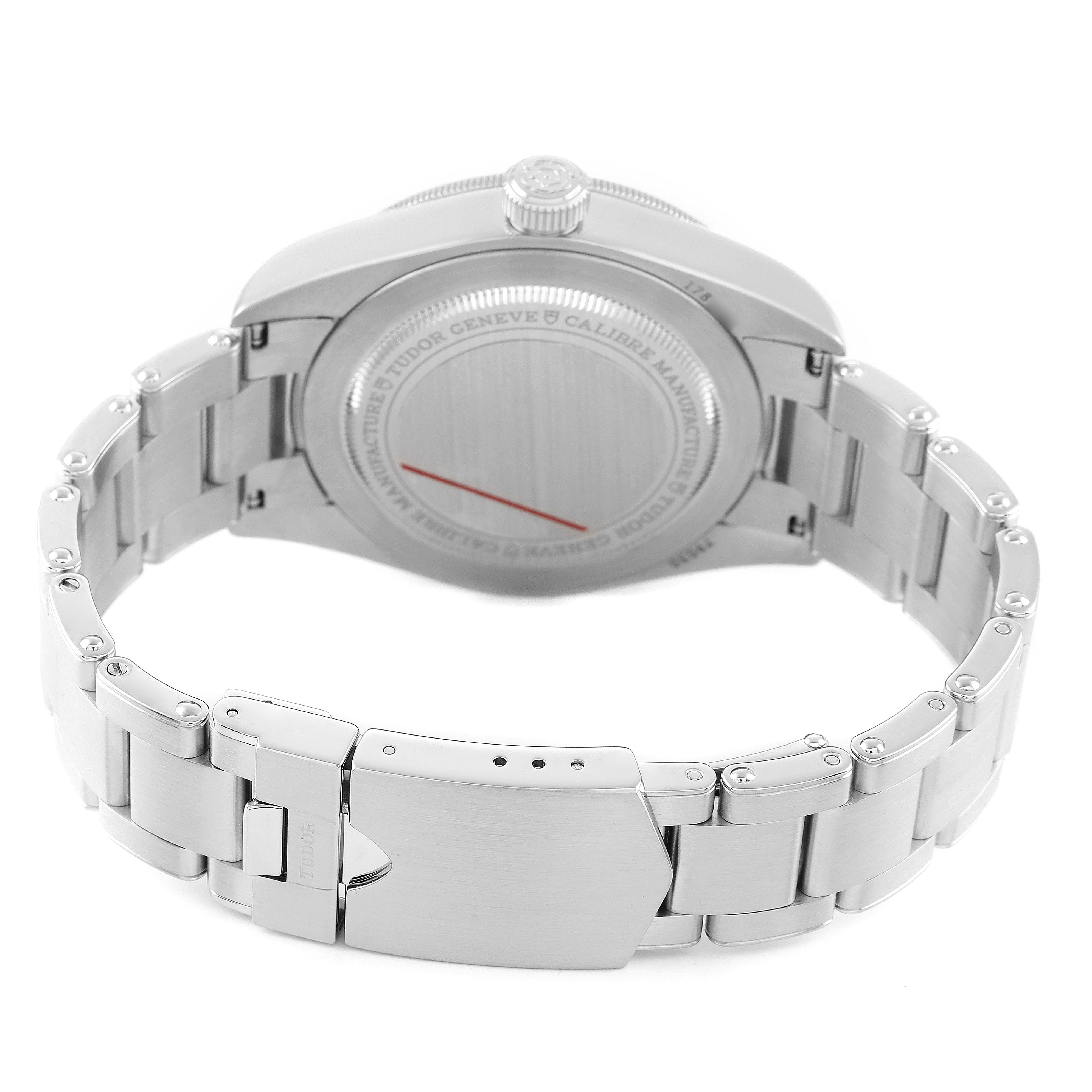 The image shows the back view of the Tudor Heritage Black Bay 79030 Men's Stainless Steel Black Dial watch, highlighting the case back, crown, and bracelet clasp.