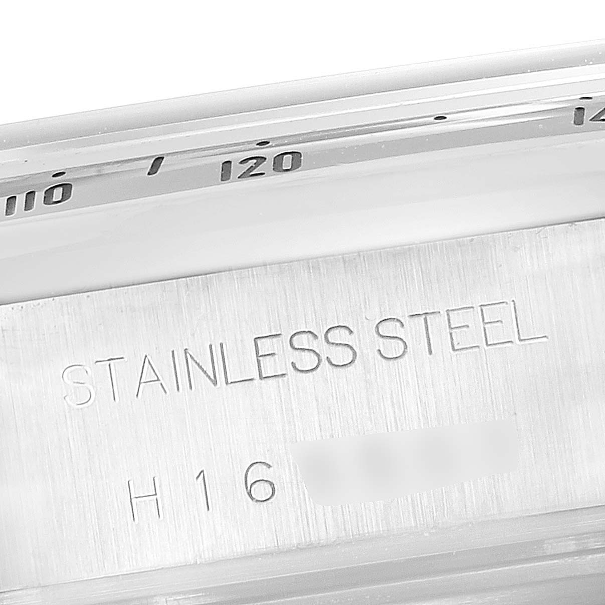 This image shows a close-up of the side of the bezel and the caseback inscription of a Tudor Tiger 79280 Men's Stainless Steel Silver Dial 79280 Men's Stainless Steel Silver Dial model watch.