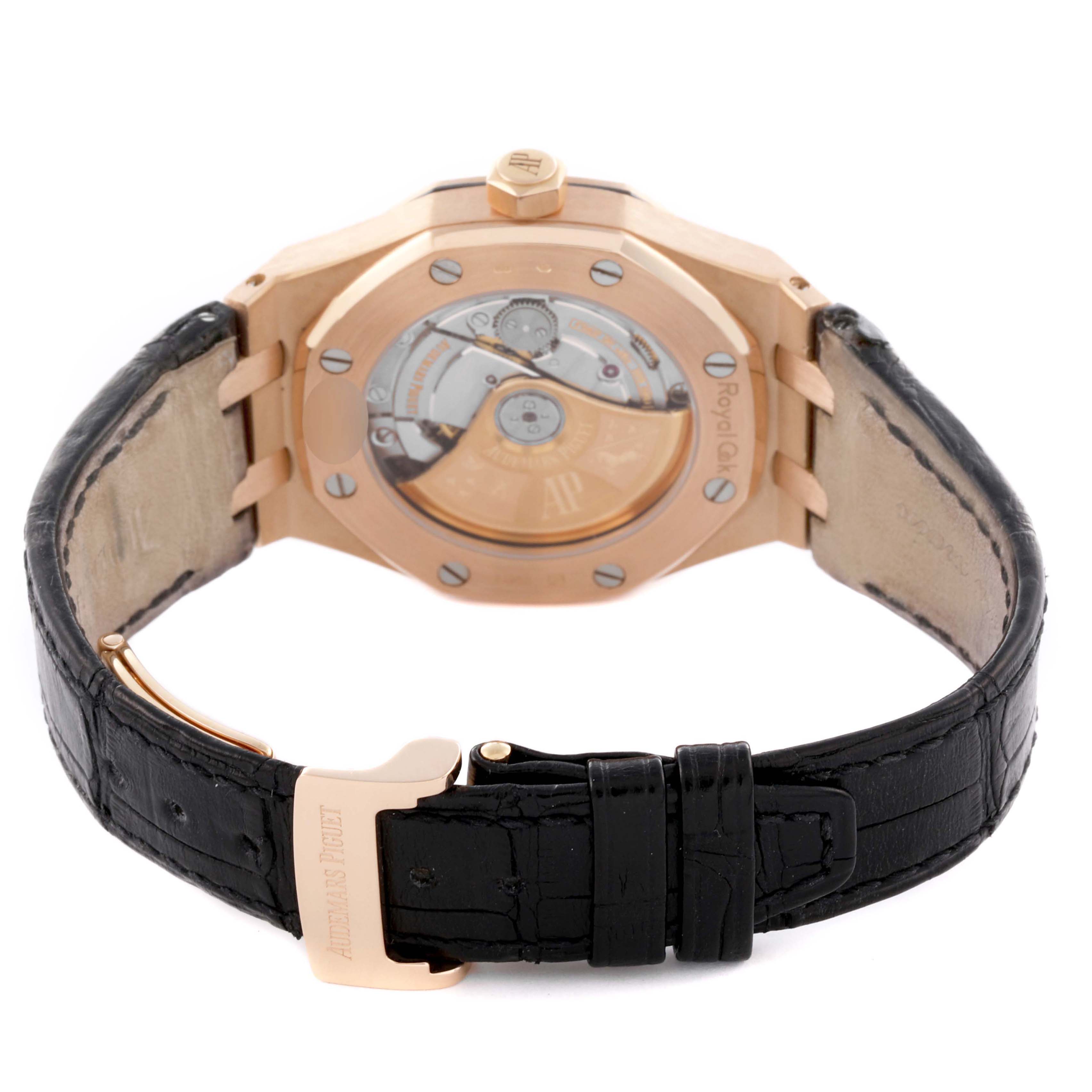 The image shows the back of an Audemars Piguet Royal Oak 15450OR.OO.D002CR.01 Men's Rose Gold Black Dial watch, highlighting the caseback, movement, and black leather strap.