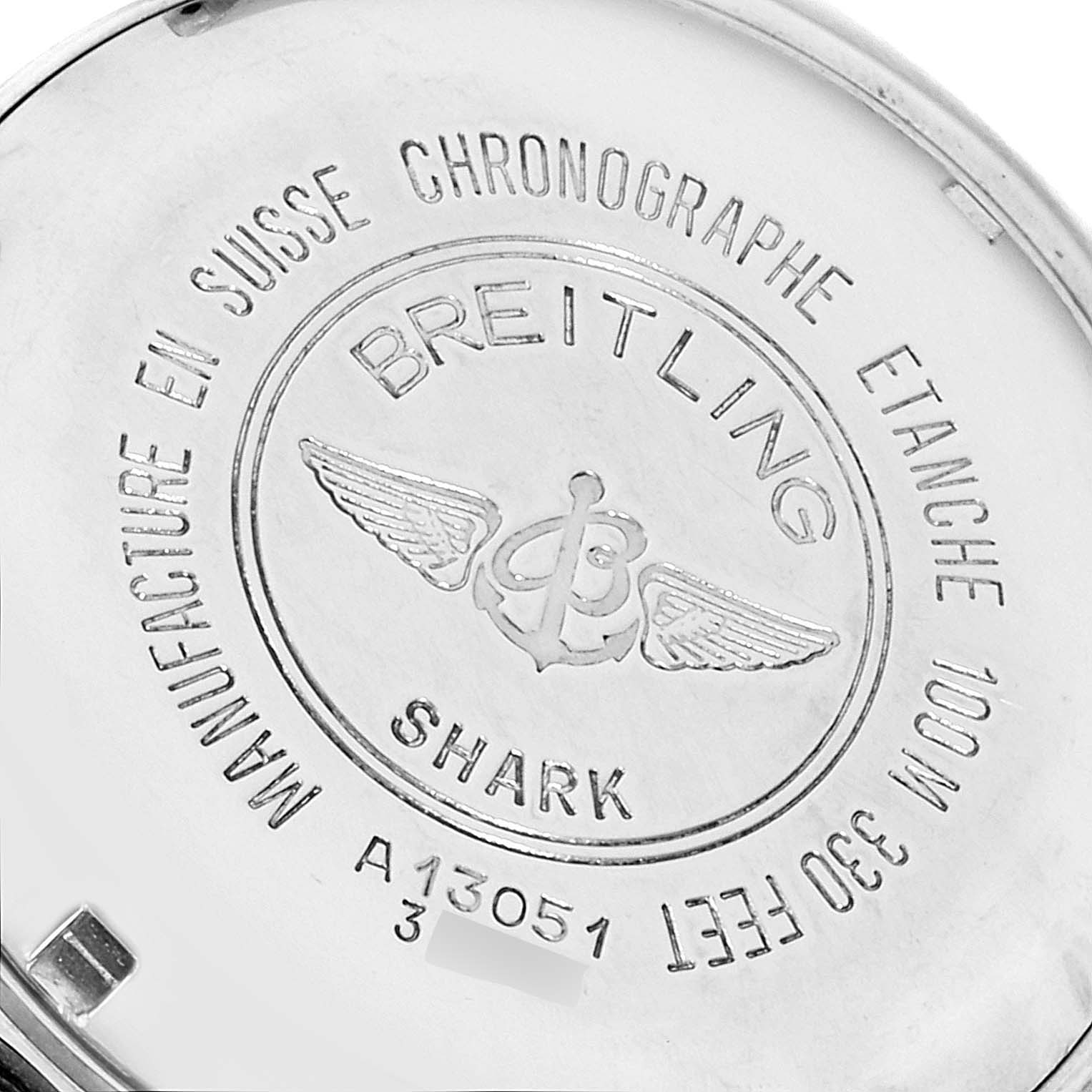 The image shows the back case of a Breitling Avenger A13051 Men
s Stainless Steel Blue Dial A13051 Men
s Stainless Steel Blue Dial model watch, highlighting engravings and brand markings.