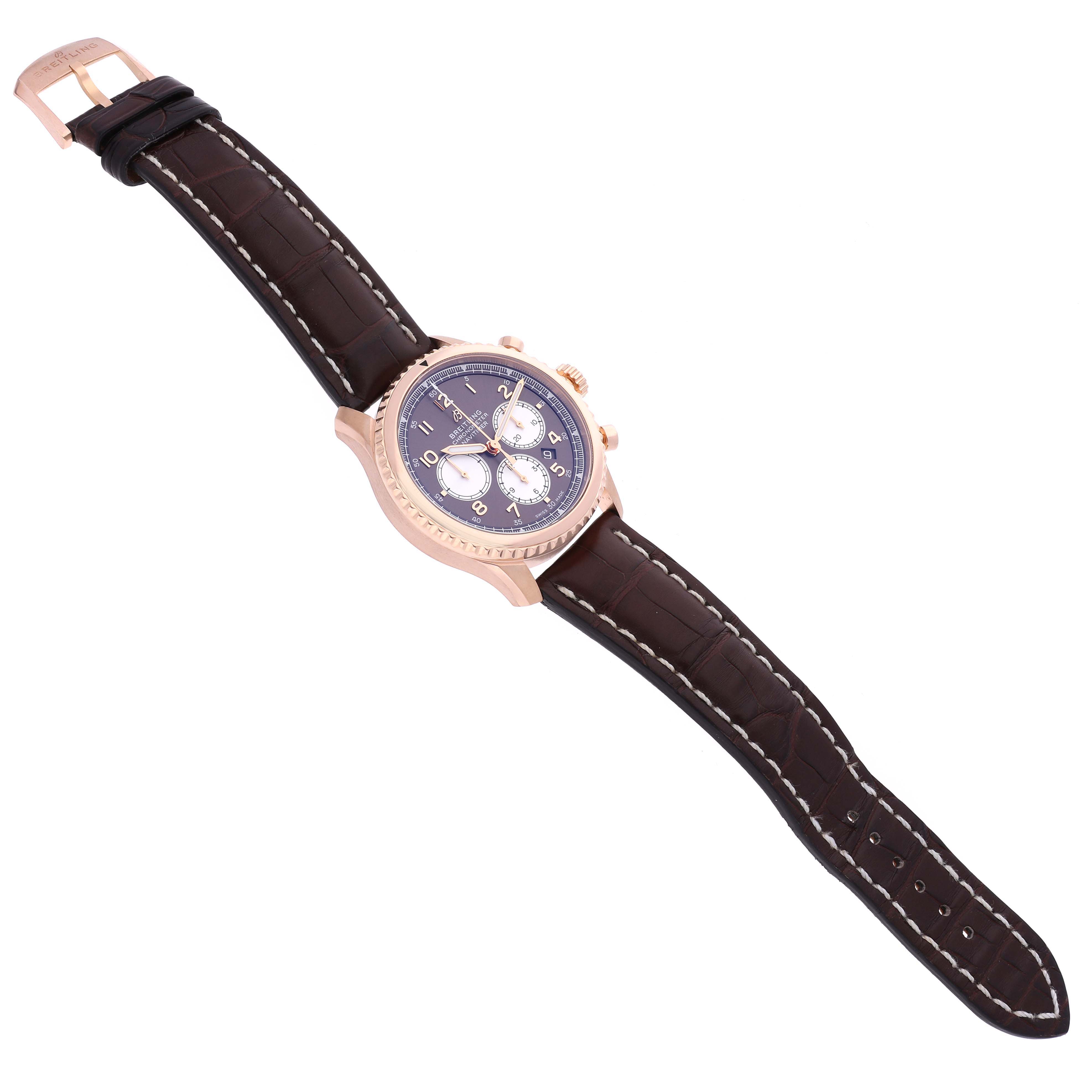 The Breitling Aviator RB0117131Q1P1 Men's Rose Gold Brown Dial RB0117131Q1P1 Men's Rose Gold Brown Dial watch is shown at an angle displaying its face, strap, and buckle from the top side.