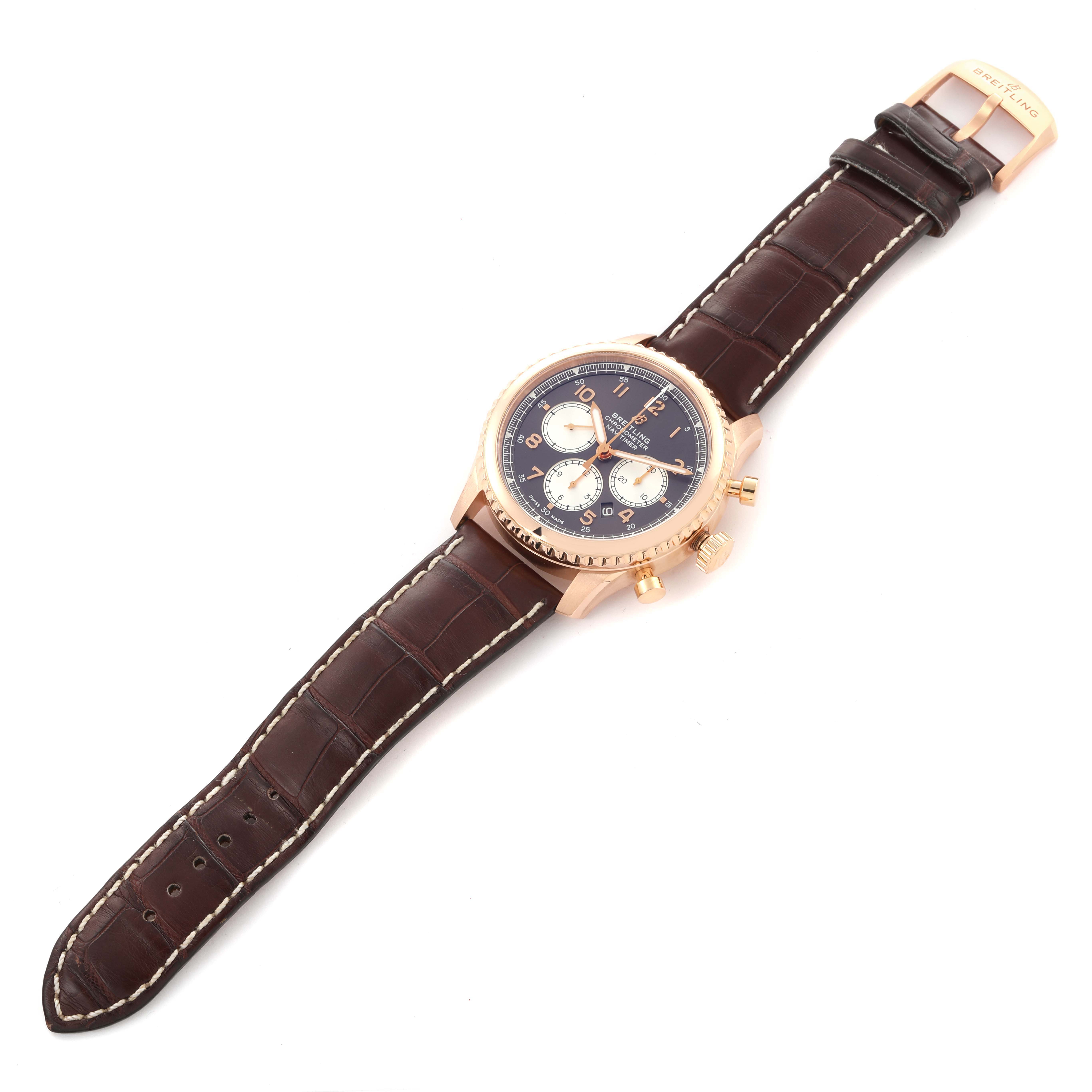 The Breitling Aviator RB0117131Q1P1 Men
s Rose Gold Brown Dial RB0117131Q1P1 Men
s Rose Gold Brown Dial watch is shown from a top angle, displaying the face, case, and brown leather strap with stitching.