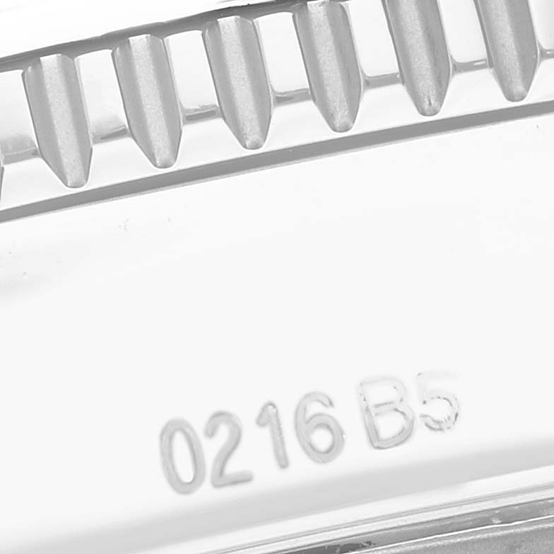 The image shows a close-up of a cogged bezel and a serial number on the Breitling Superocean A17365 Men's Stainless Steel Black Dial A17365 Men's Stainless Steel Black Dial watch.