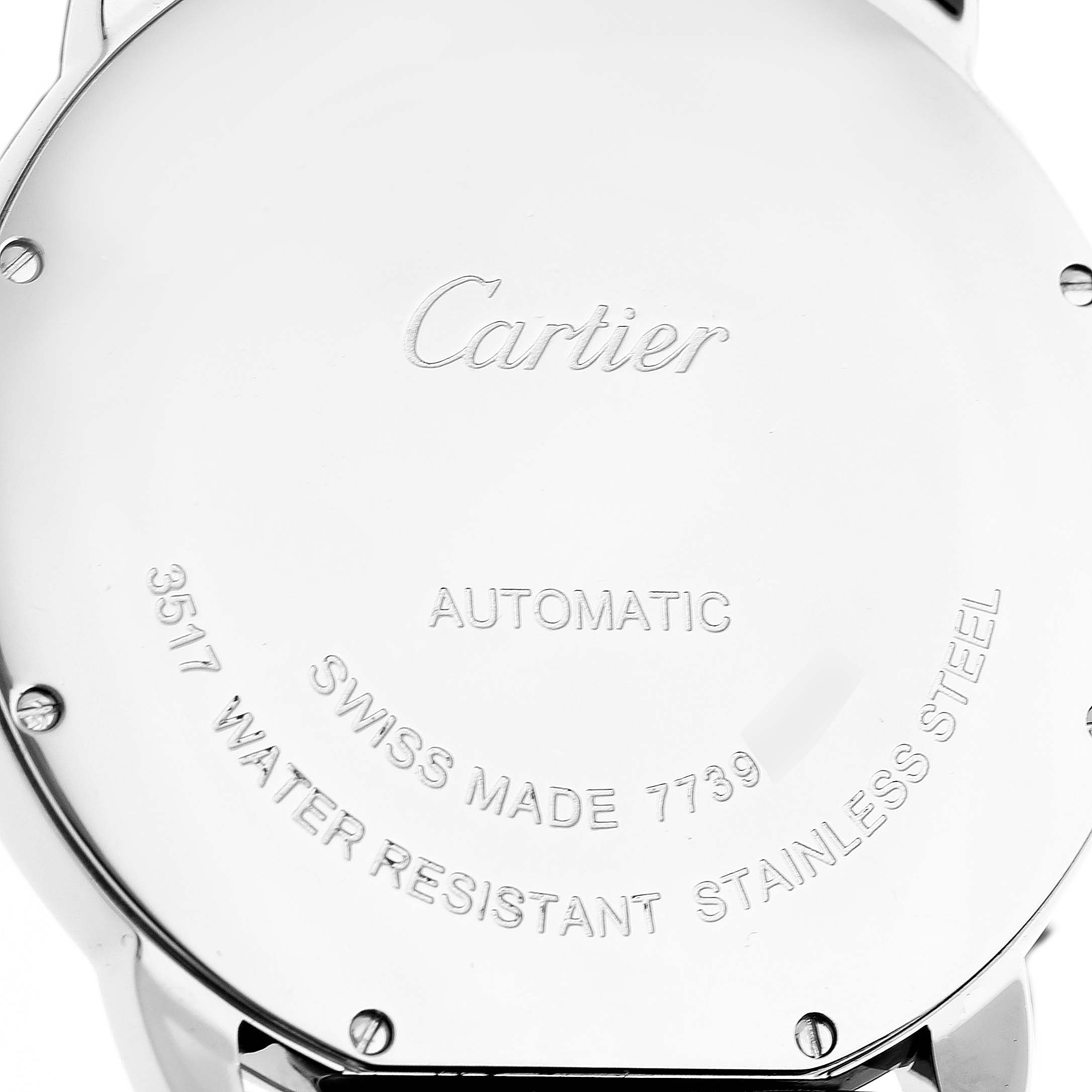 The image shows the back case of a Cartier Ronde W6701010 Men's Stainless Steel Silver Dial watch at a straight-on angle, highlighting engraved details and screws.