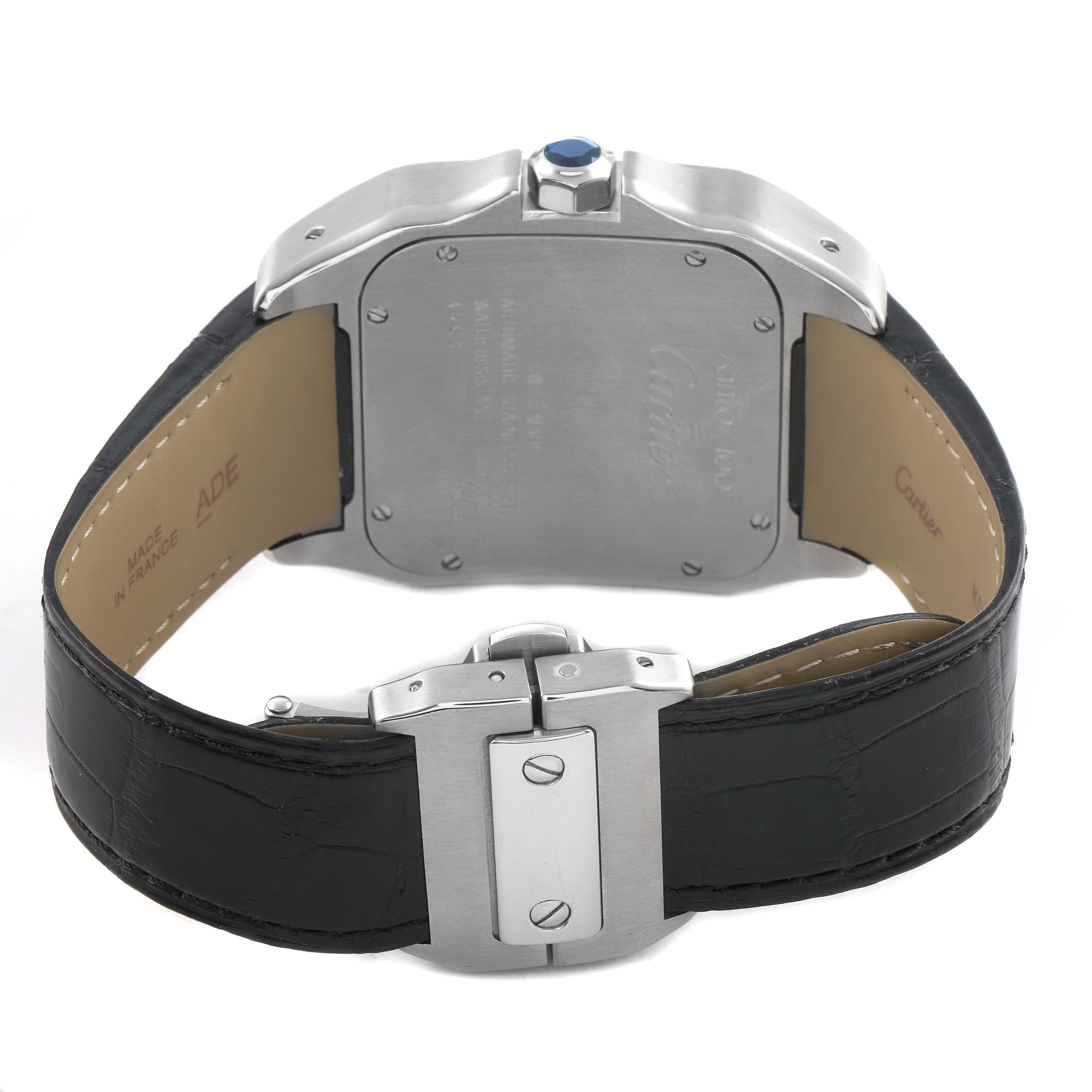 The image shows the back of a Cartier Santos W20073X8 Men's Stainless Steel Silver Dial watch, highlighting the case back, crown, and leather strap with a clasp.