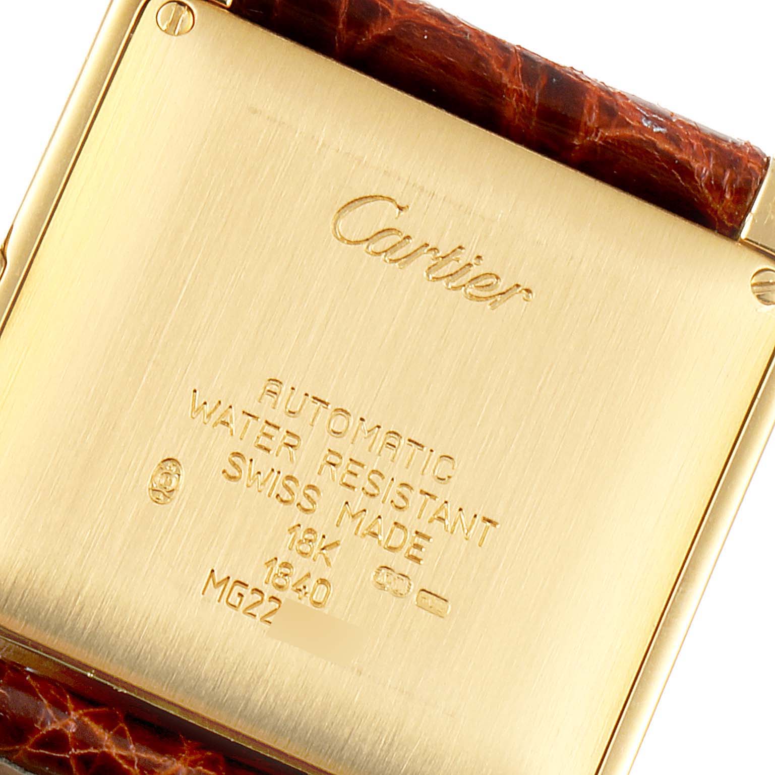 This image shows the back view of a Cartier Tank Française watch, highlighting the brand engraving and specifications.