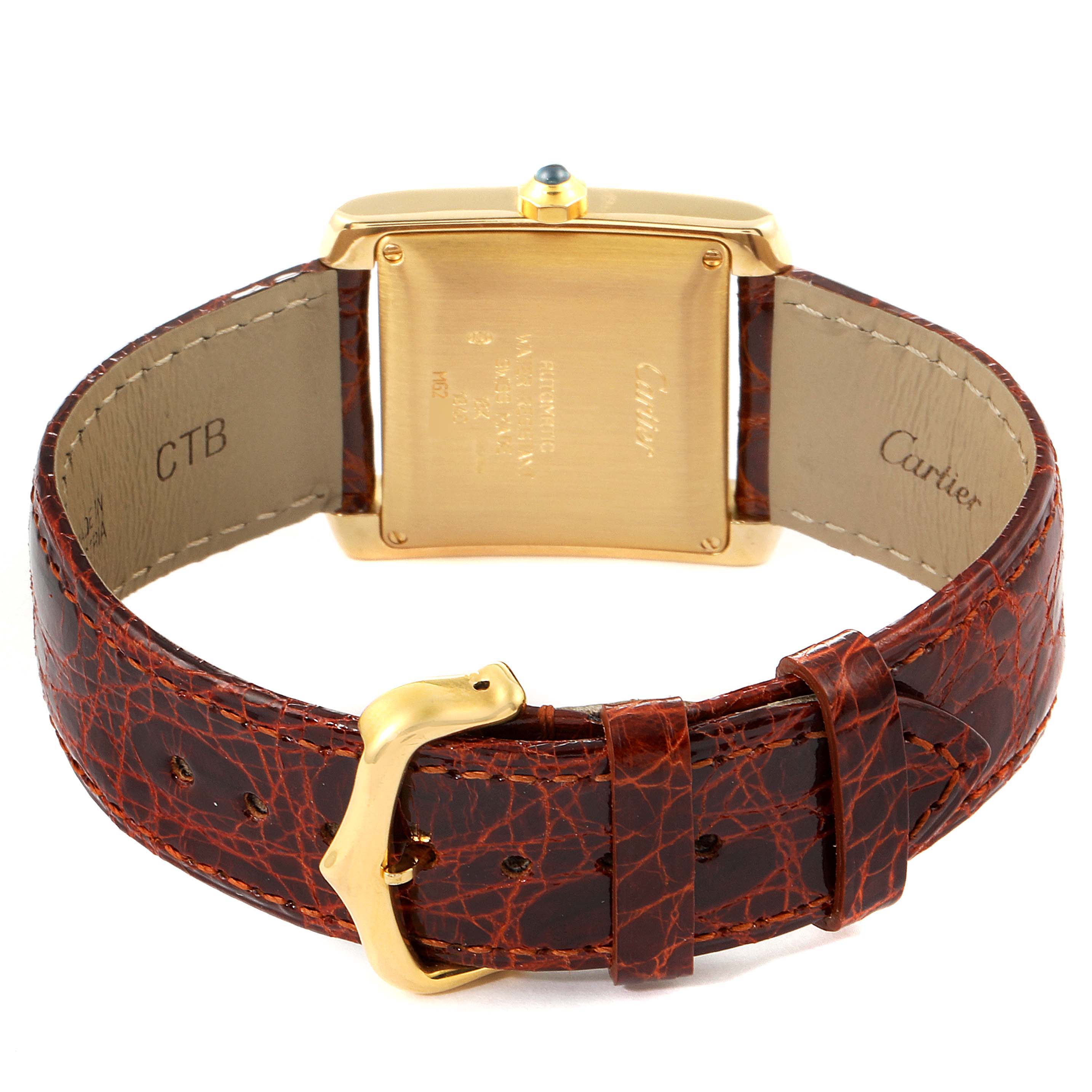 This image shows the back of a Cartier Tank Francaise W5000156 Men's Yellow Gold Silver Dial W5000156 Men's Yellow Gold Silver Dial watch with a brown leather strap and gold buckle.