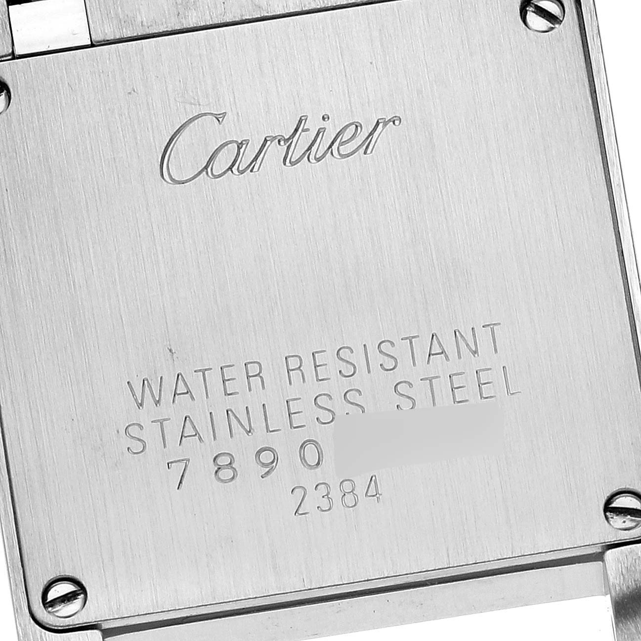 The image shows the back case of a Cartier Tank Francaise W51008Q3 Women
s Stainless Steel Silver Dial W51008Q3 Women
s Stainless Steel Silver Dial watch, featuring inscriptions about water resistance and material.