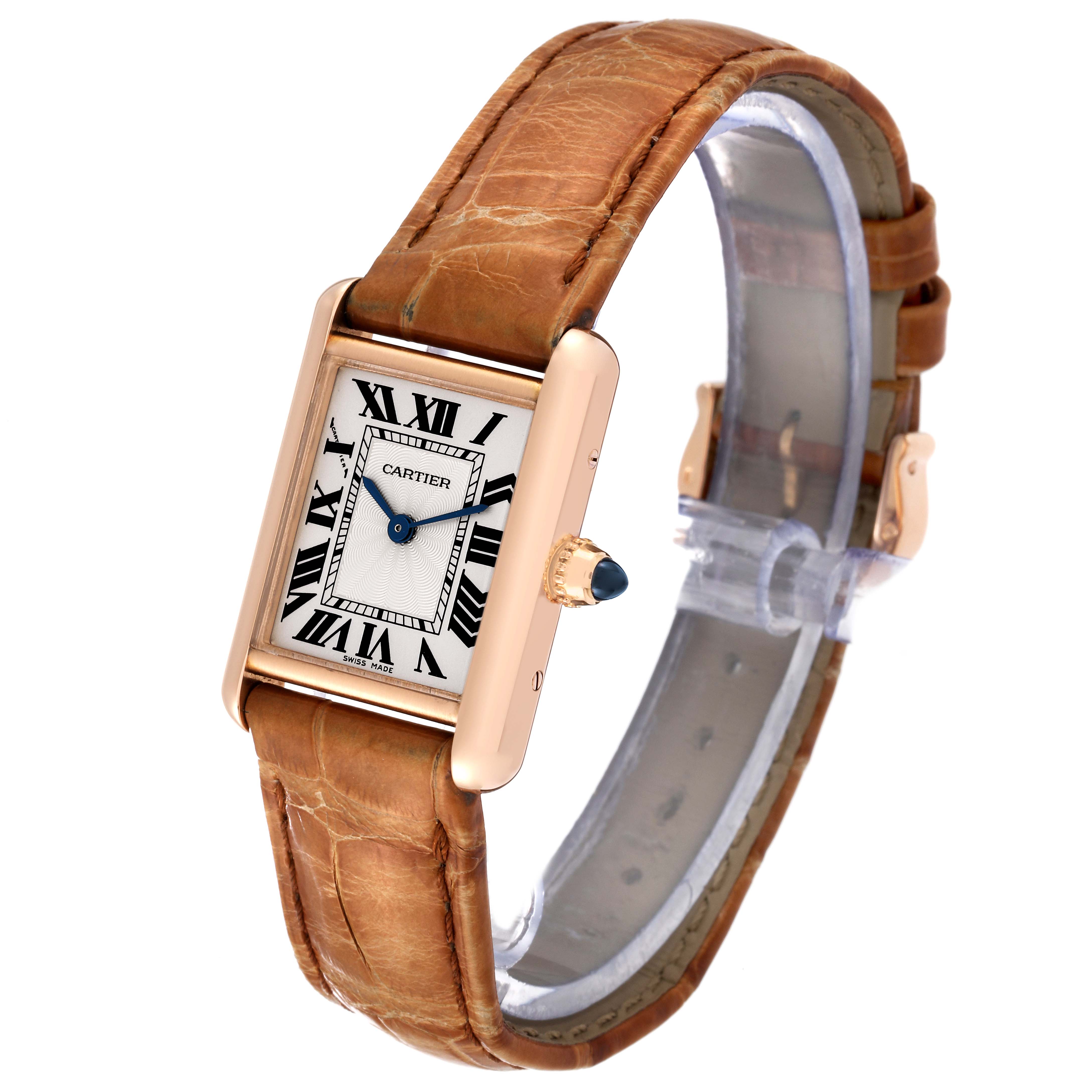 A Cartier Tank Louis WGTA0010 Women's Rose Gold Silver Dial WGTA0010 Women's Rose Gold Silver Dial watch is shown at an angle, focusing on its rectangular dial, Roman numerals, and brown leather strap.