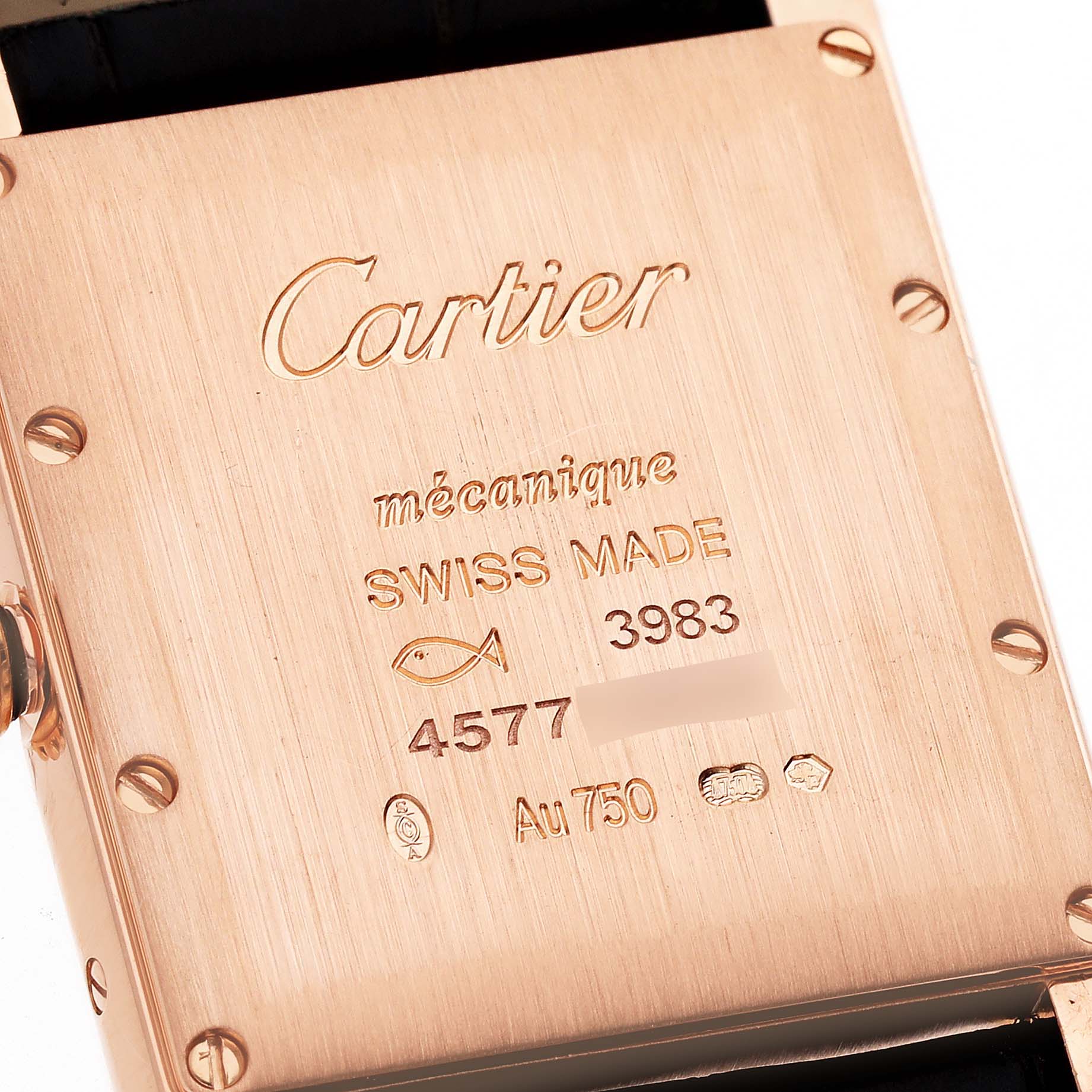 This image shows the back case of a Cartier Tank Louis WGTA0011 Men's Rose Gold Silver Dial WGTA0011 Men's Rose Gold Silver Dial watch, highlighting its engravings and screws.
