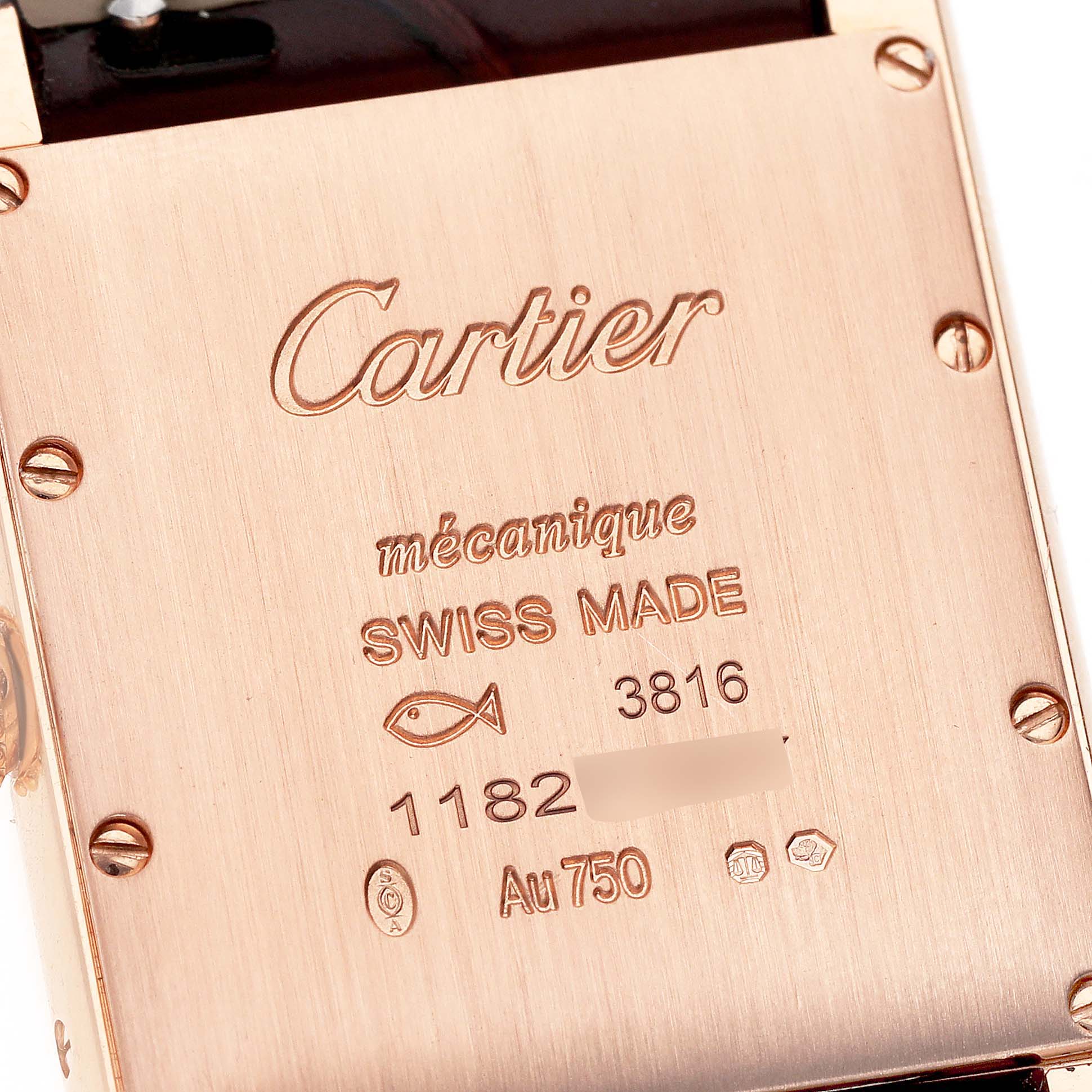 The image shows the case back of a Cartier Tank Louis WGTA0011 Men
s Rose Gold Silver Dial WGTA0011 Men
s Rose Gold Silver Dial watch, displaying the brand and model inscriptions.