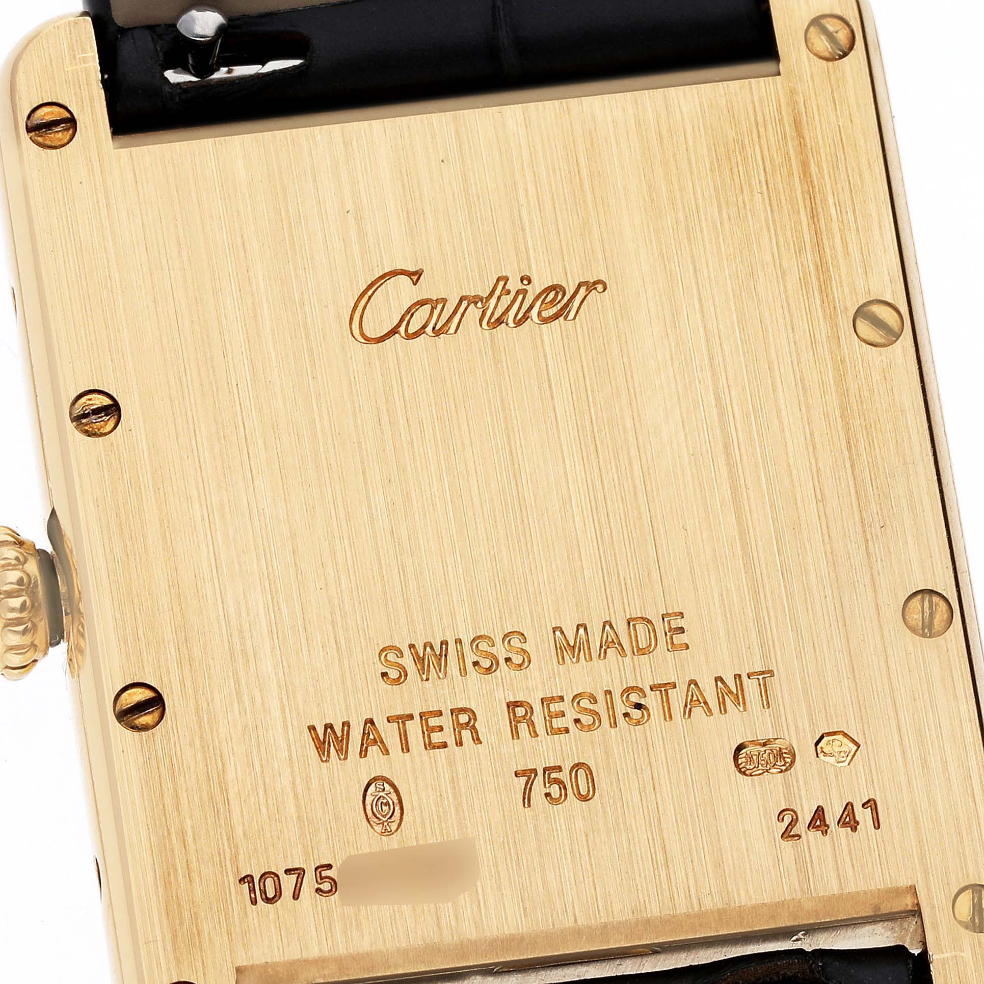 This image shows the back case of a Tank Louis model watch by Cartier, displaying brand engraving and specifications.