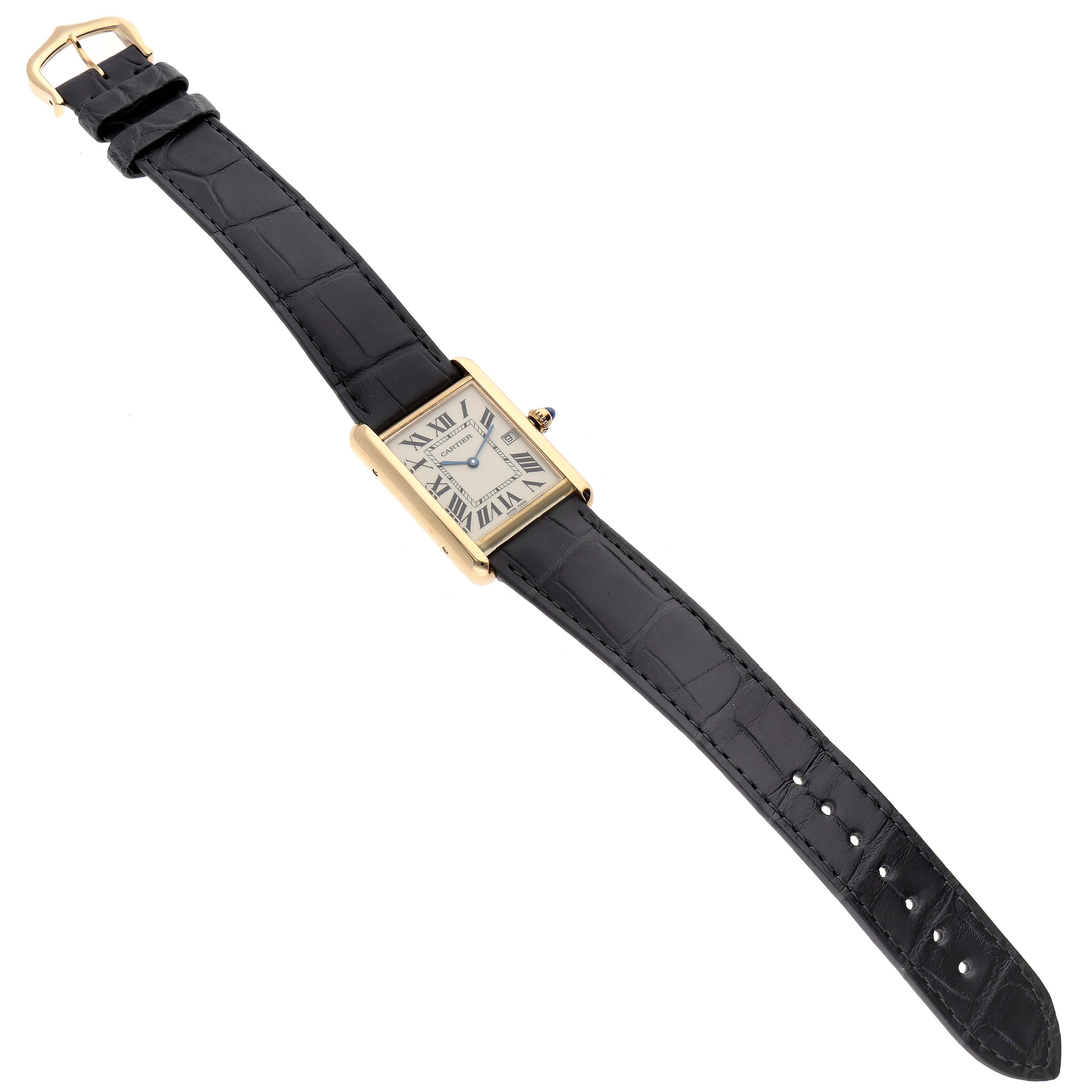 This Cartier Tank Louis W1529756 Men
s Yellow Gold Silver Dial W1529756 Men
s Yellow Gold Silver Dial watch is photographed from a top-down angle, showing its full strap, clasp, and rectangular face.