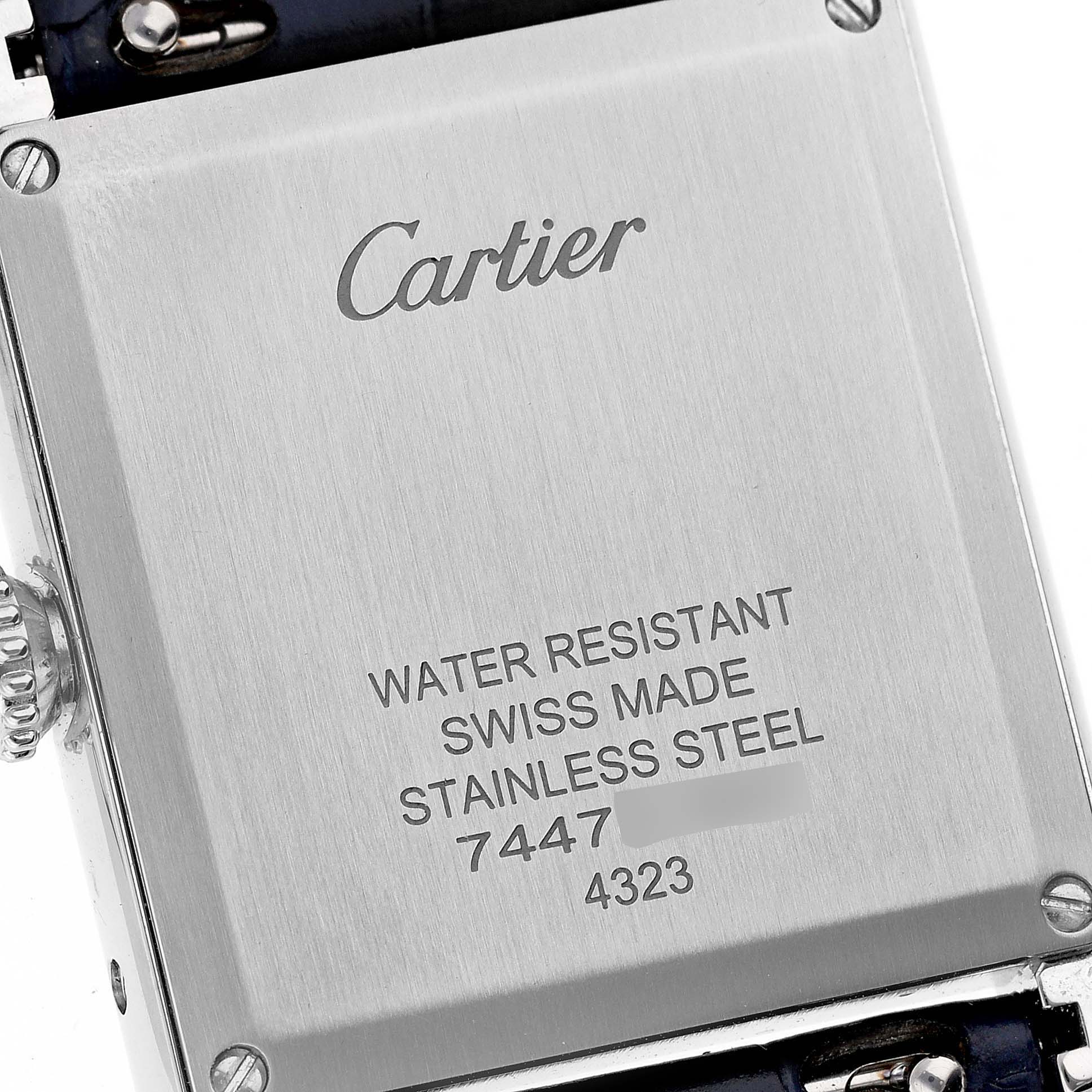 This image shows the back case of a Cartier Tank Must WSTA0055 Women
s Stainless Steel Blue Dial WSTA0055 Women
s Stainless Steel Blue Dial watch, highlighting the brand logo and specifications.