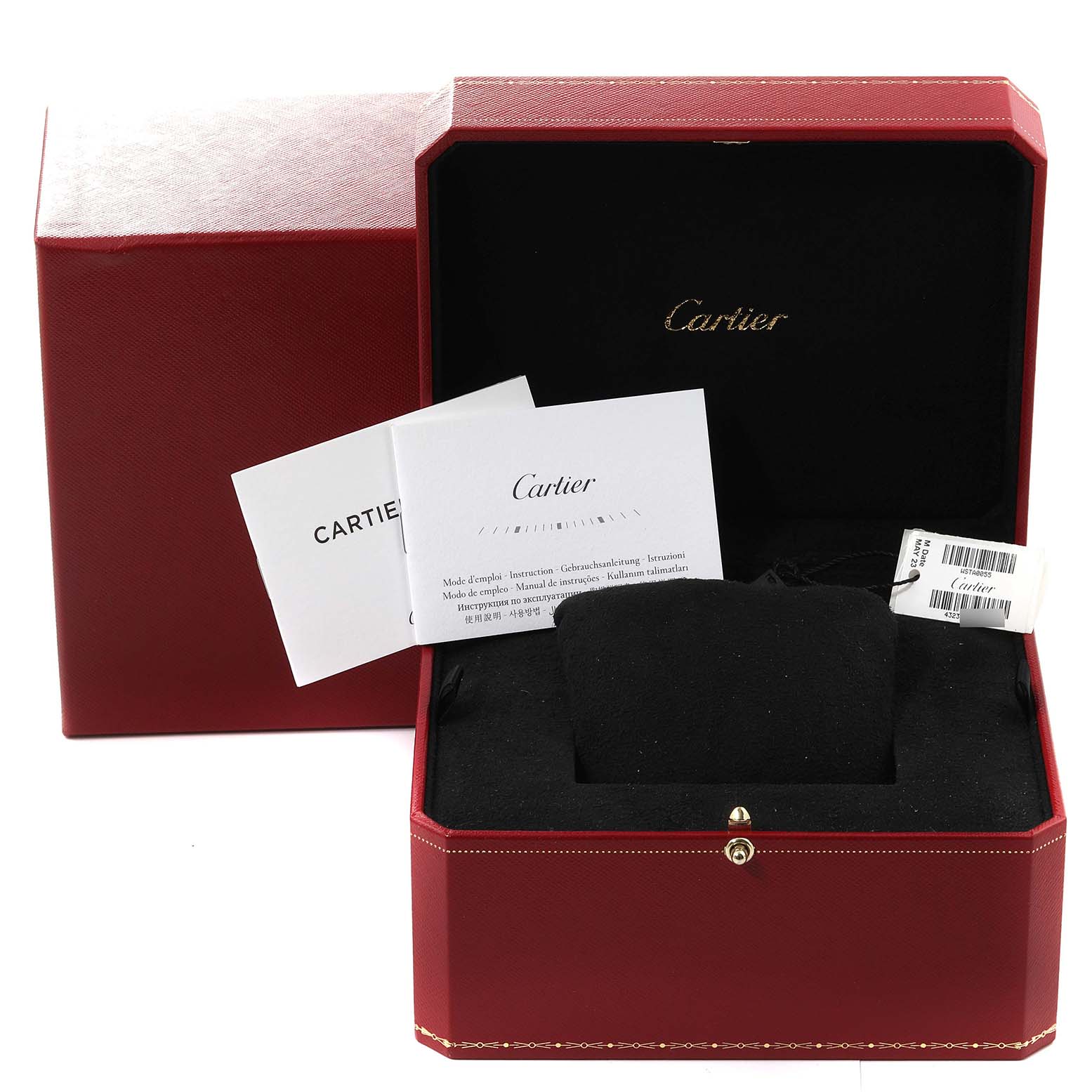 This image shows the packaging and accessories for a Cartier Tank Must WSTA0055 Women
s Stainless Steel Blue Dial WSTA0055 Women
s Stainless Steel Blue Dial watch, including the box, pillow, and manuals.