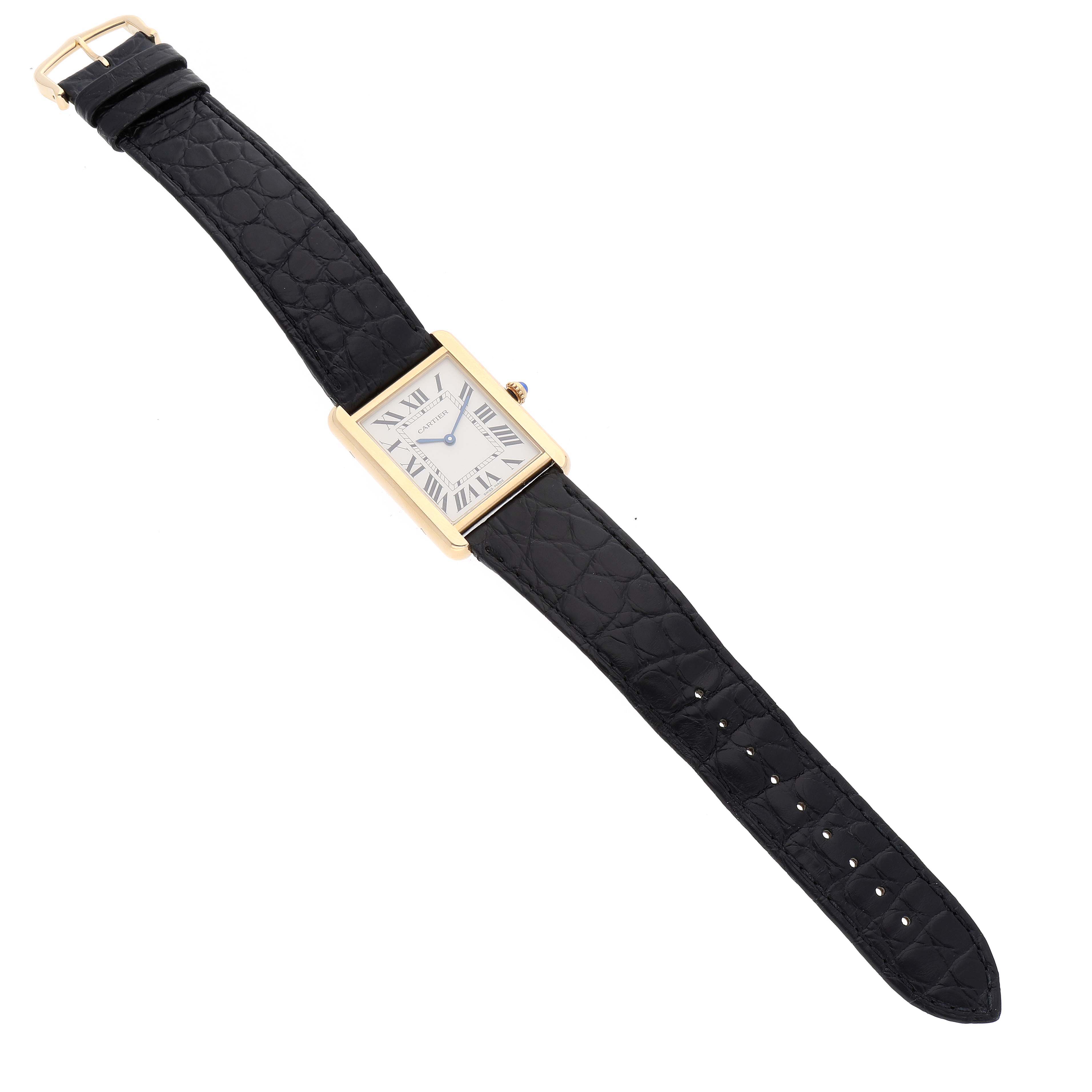 The Cartier Tank Solo W5200004 Men
s Steel and Gold (two tone) Silver Dial W5200004 Men
s Steel and Gold (two tone) Silver Dial watch is shown from a top-down angle, displaying the rectangular face, black leather strap, and gold case.