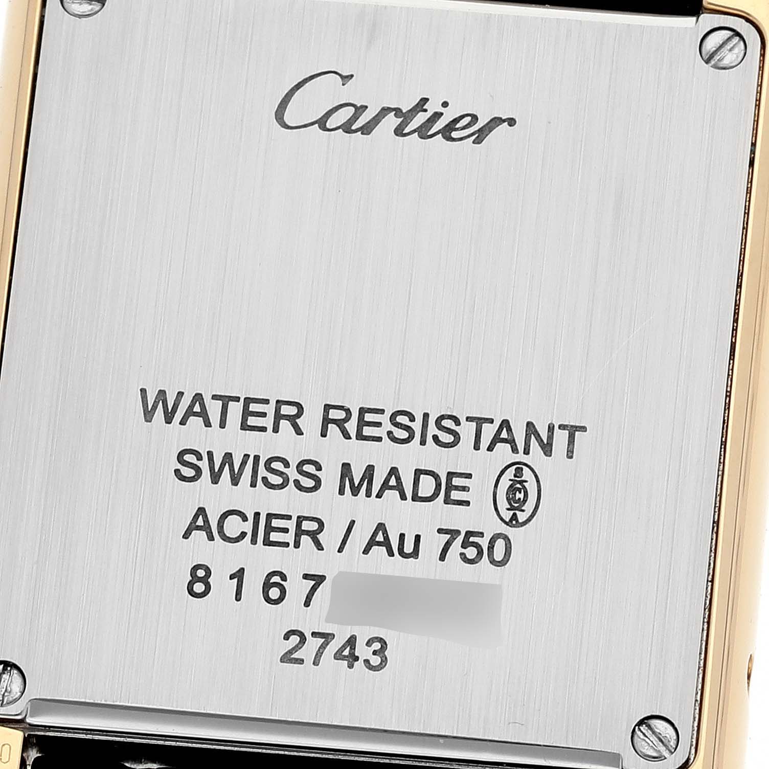 The image shows the back case of a Cartier Tank Solo W1018755 Women
s Steel and Gold (two tone) Silver Dial W1018755 Women
s Steel and Gold (two tone) Silver Dial watch, displaying branding and specifications.