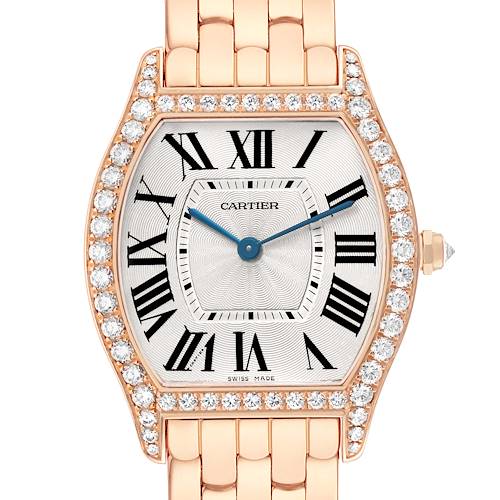 The Cartier Tortue WA501012 Women's Rose Gold Silver Dial watch is shown from the front, highlighting its diamond-studded bezel, Roman numerals, and bracelet.
