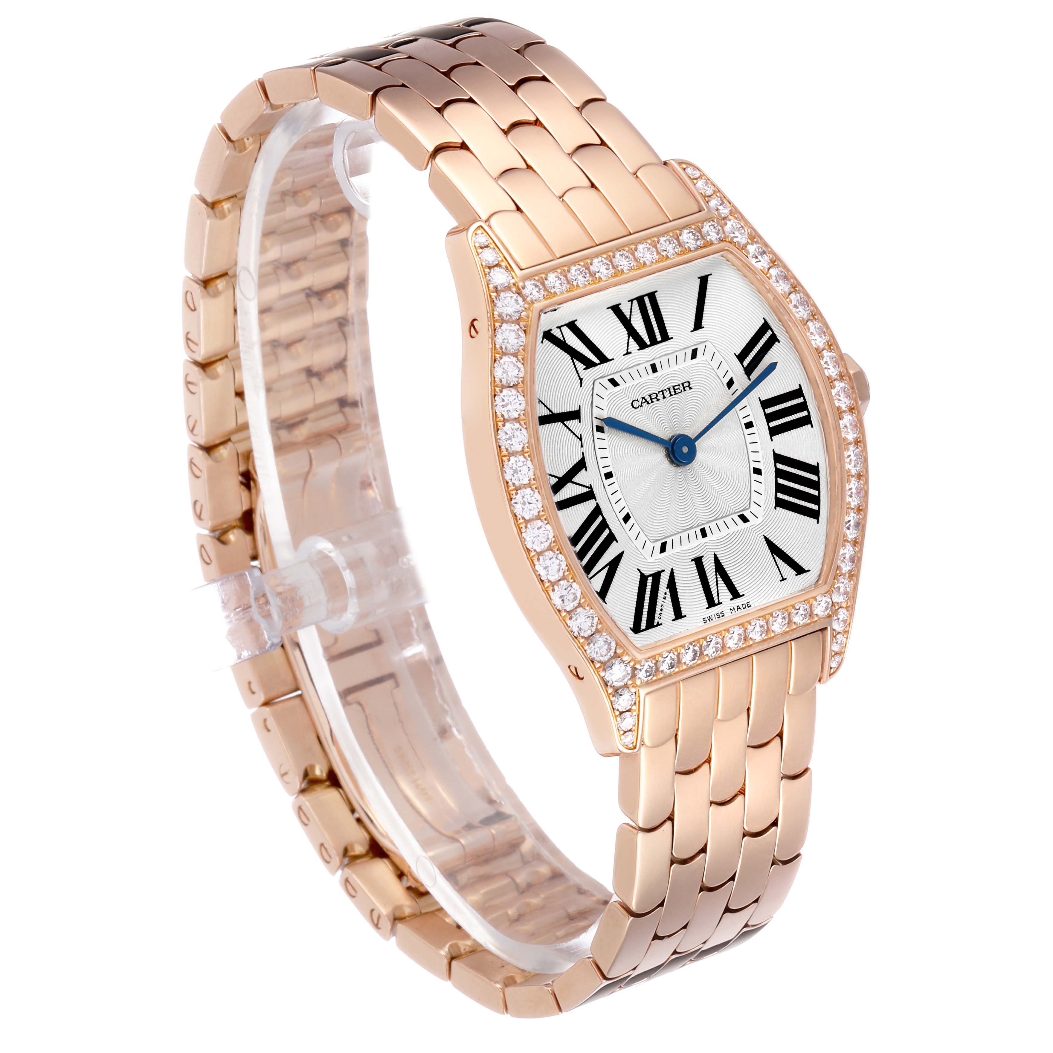 The Cartier Tortue WA501012 Women's Rose Gold Silver Dial watch is shown at a three-quarter angle, displaying its rose gold case, diamond bezel, and bracelet.