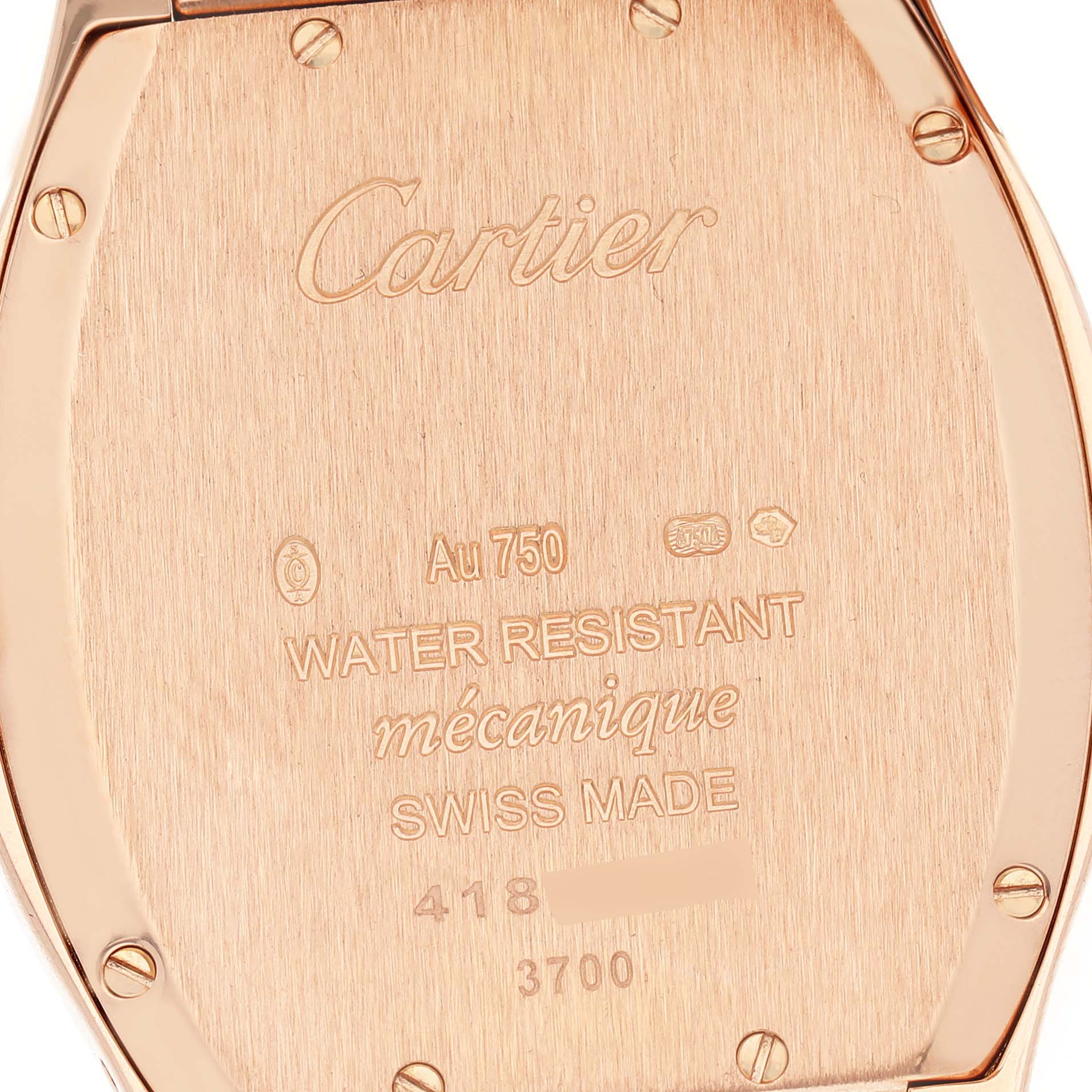 The image shows the back case of a Cartier Tortue WA501012 Women's Rose Gold Silver Dial watch, displaying engravings and screws.
