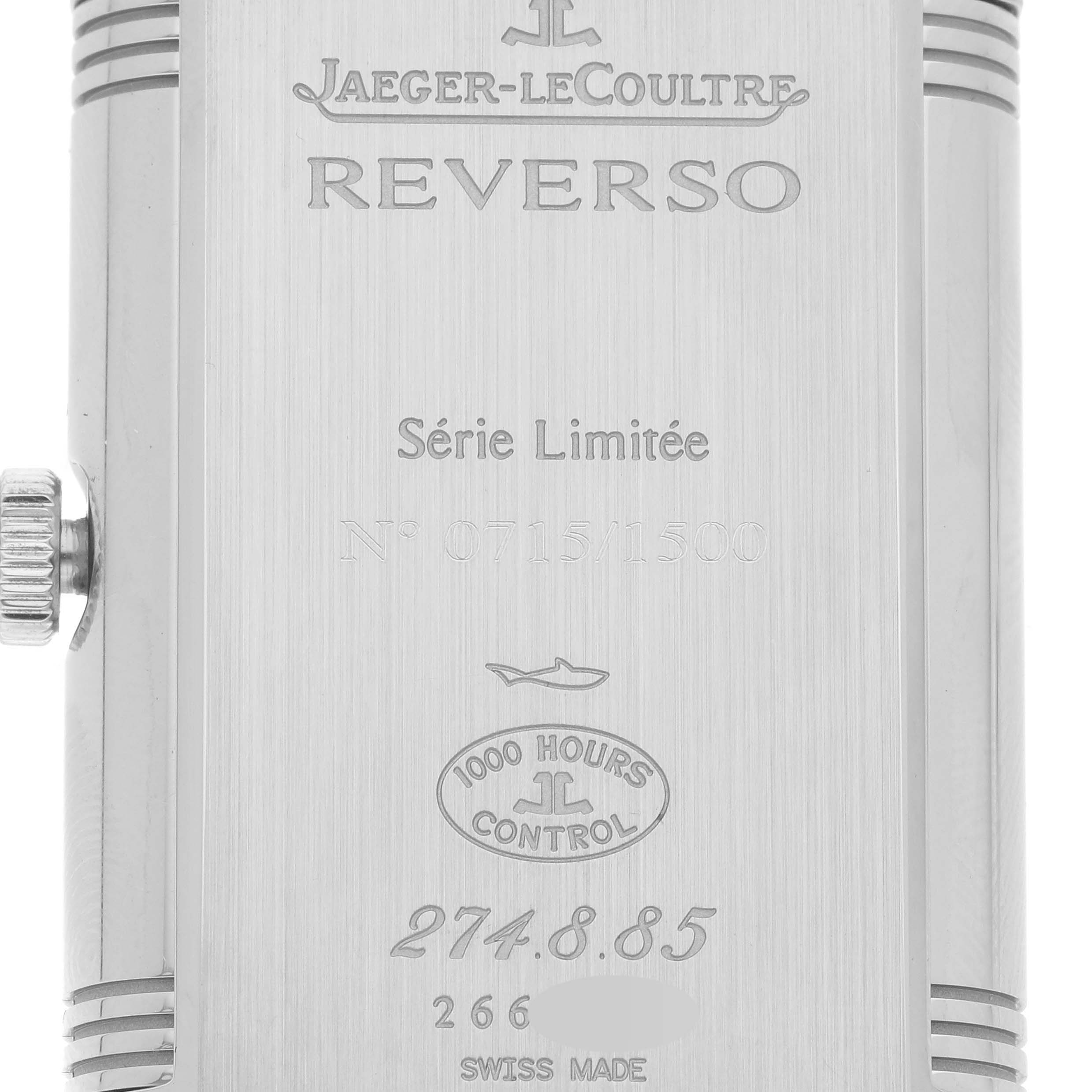 The image shows the back view of a Jaeger-LeCoultre Reverso watch, displaying model details and engravings.
