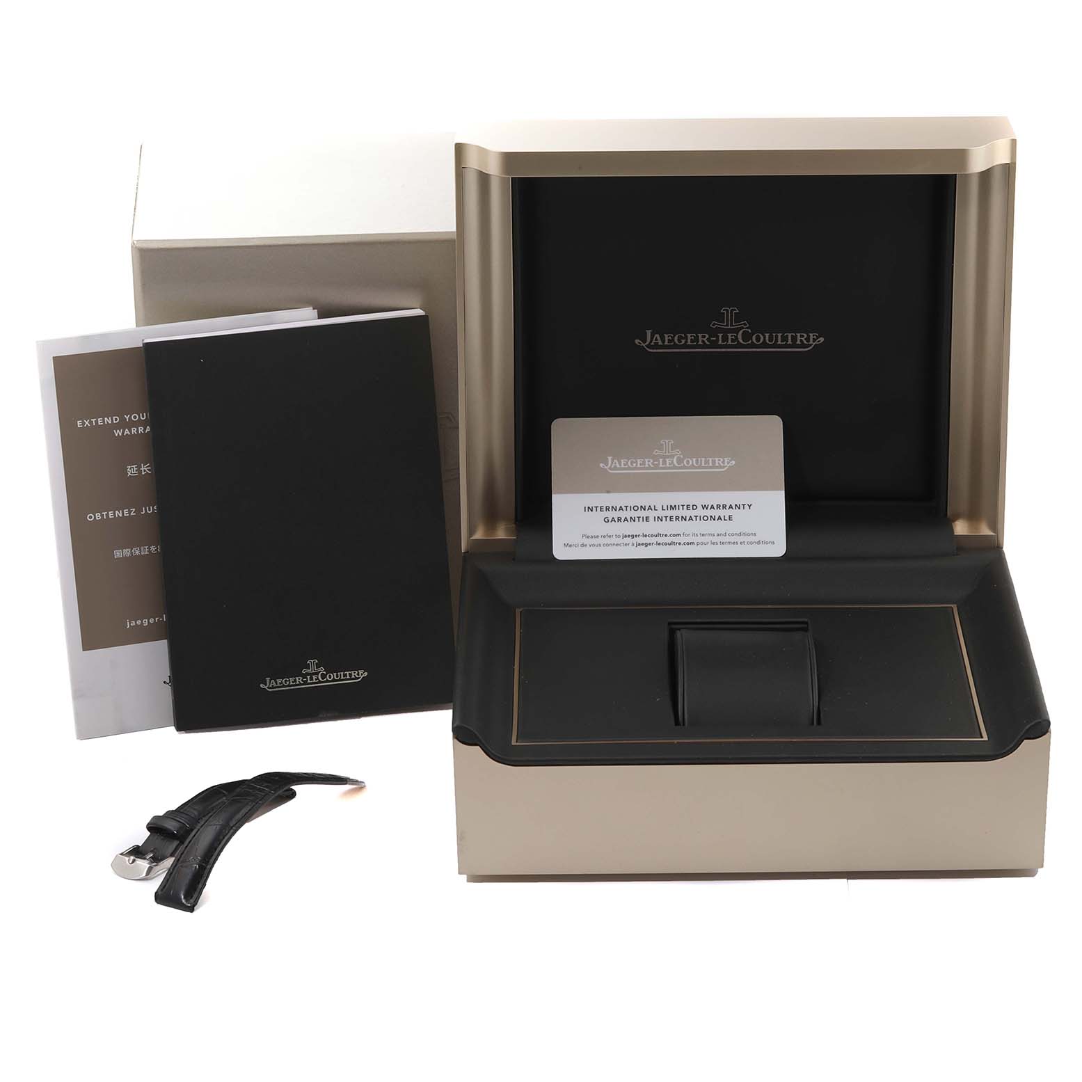 The image shows a Jaeger LeCoultre Reverso Q2668432 Women's Stainless Steel Silver Dial Q2668432 Women's Stainless Steel Silver Dial watch box, international warranty card, booklets, and an extra leather strap.