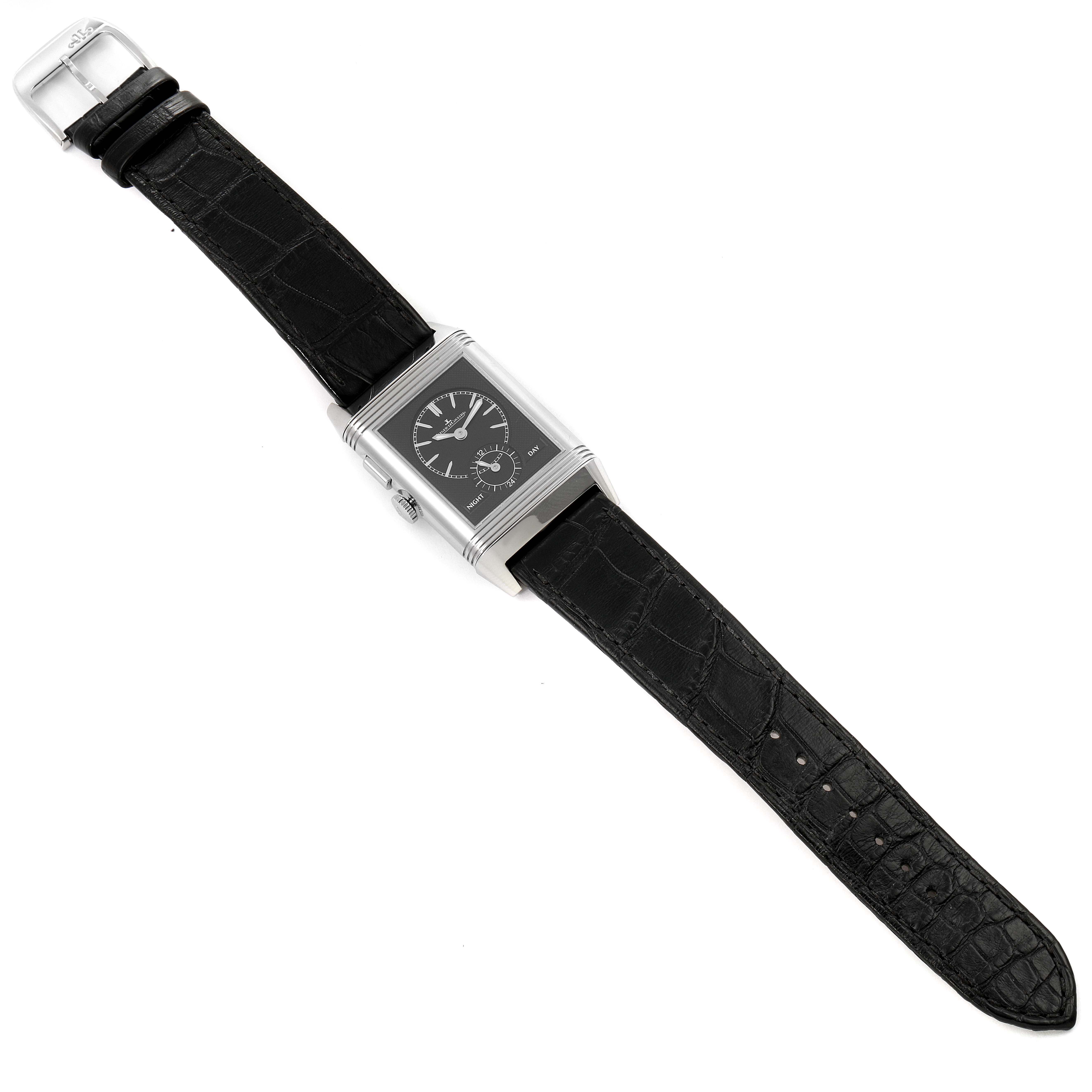 This is a top-down view of a Jaeger LeCoultre Reverso Q3788570 Men's Stainless Steel Silver Dial Q3788570 Men's Stainless Steel Silver Dial watch, displaying its black leather strap and rectangular dial.