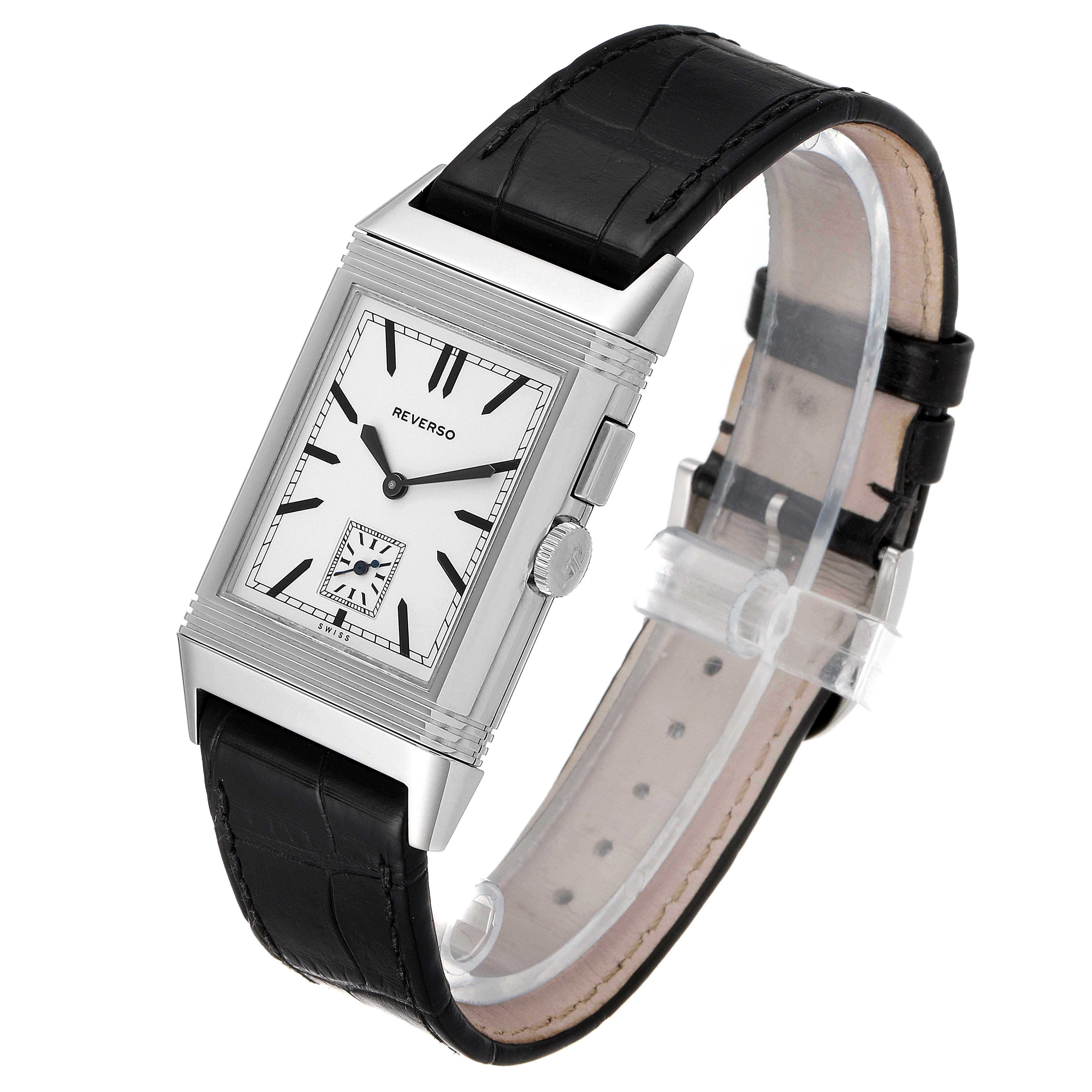 The image shows a front angle of the Jaeger-LeCoultre Reverso watch, highlighting its black leather strap and rectangular dial.