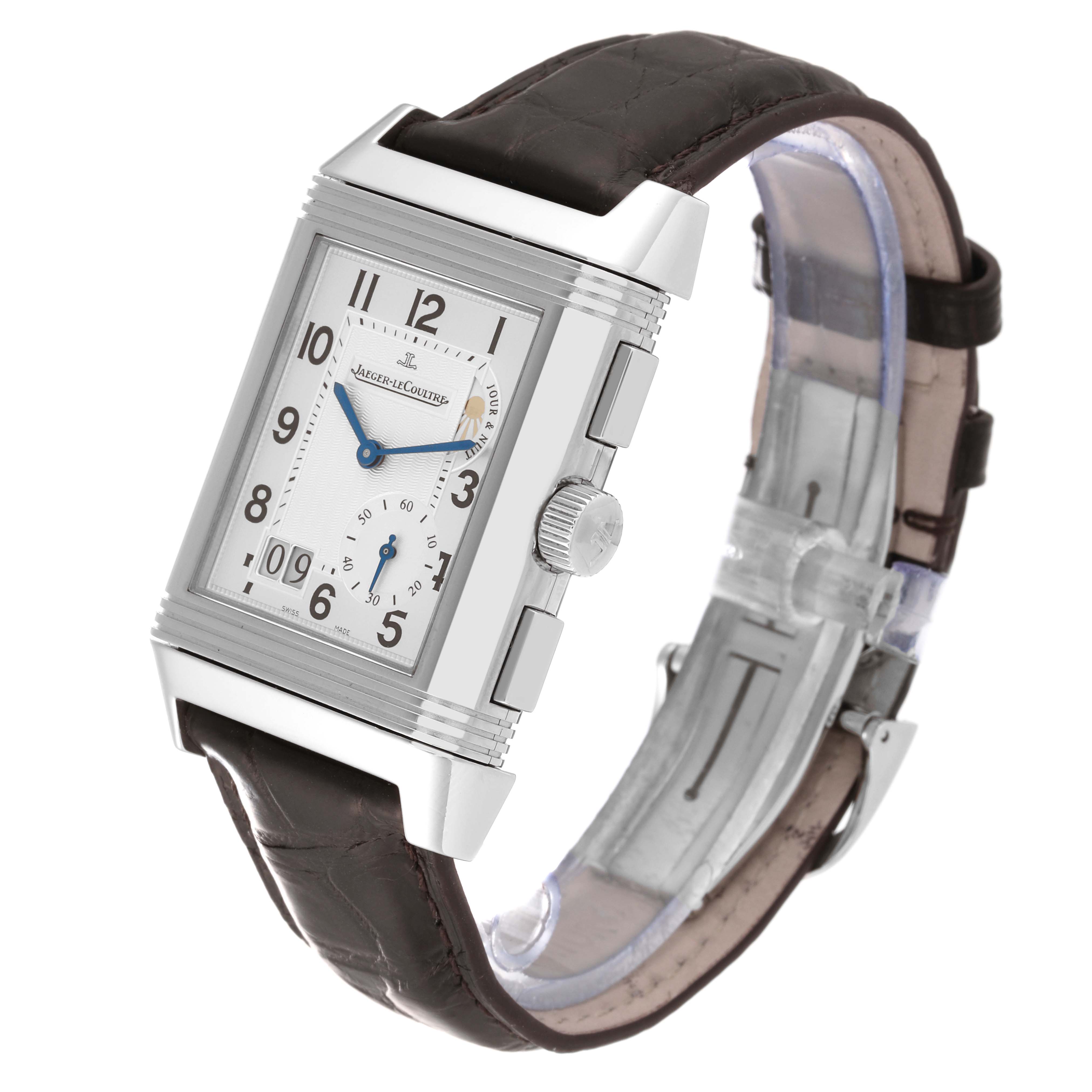 The image shows a Jaeger LeCoultre Reverso Q3028420 Men
s Stainless Steel Silver Dial Q3028420 Men
s Stainless Steel Silver Dial watch at a tilted angle, featuring its rectangular dial, crown, and leather strap.