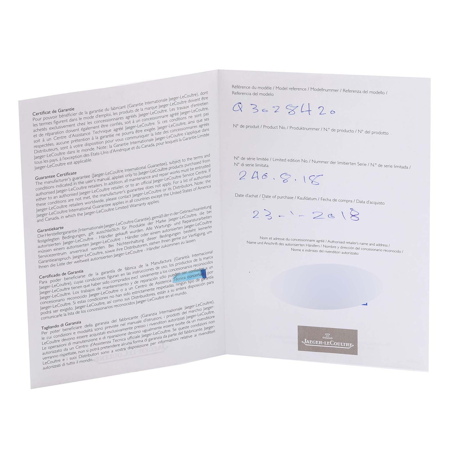 The image shows an open warranty certificate booklet for a Jaeger-LeCoultre Reverso model watch.