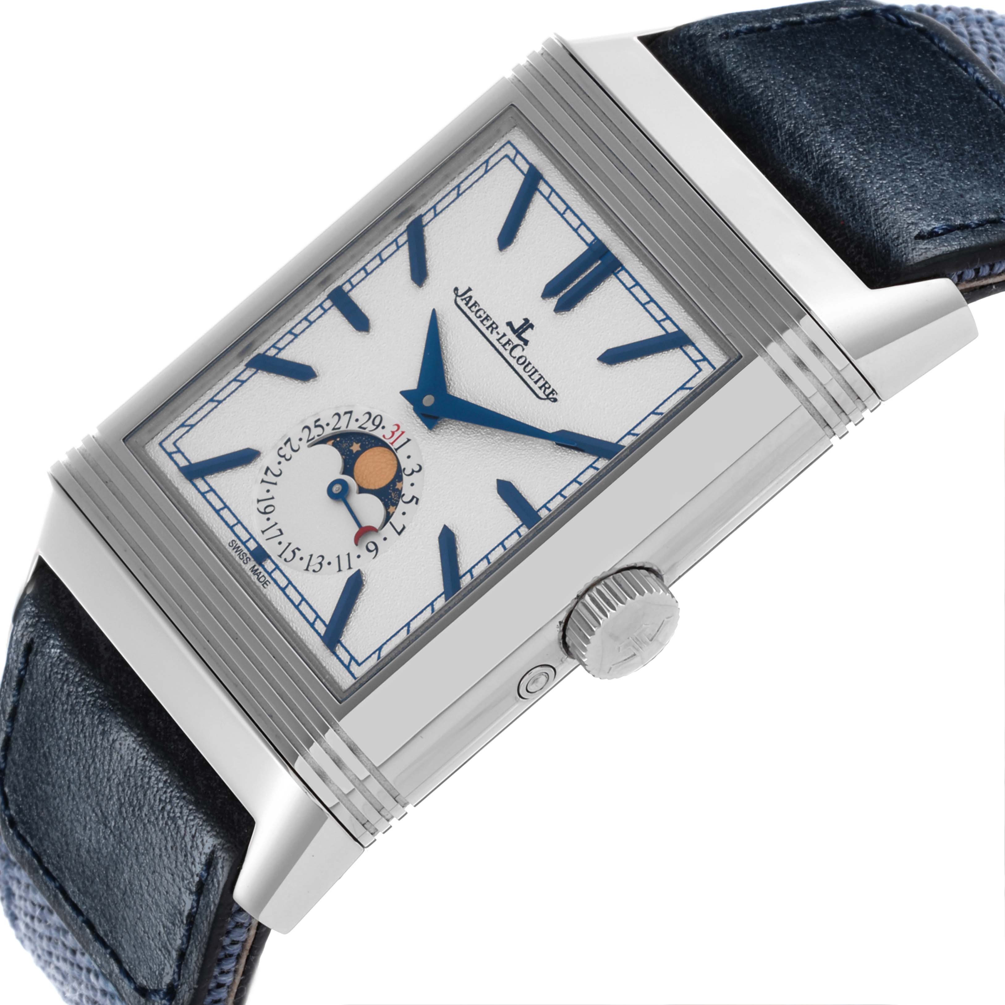The Jaeger-LeCoultre Reverso watch is shown at an angle highlighting the face, crown, and partial strap with a focus on the moon phase and date subdial.