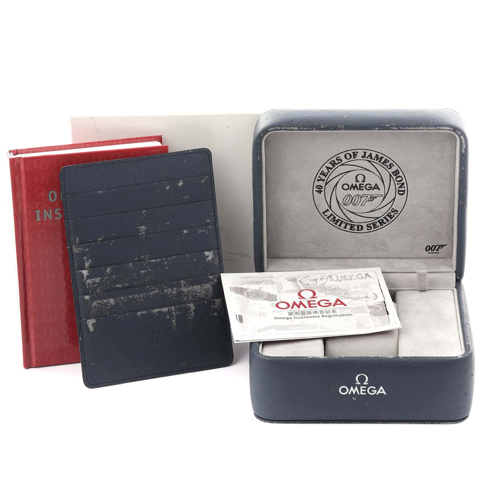 The image shows the Omega Seamaster 2537.80.00 Men's Stainless Steel Blue Dial 2537.80.00 Men's Stainless Steel Blue Dial box, warranty card holder, and instruction booklet at an angled view.