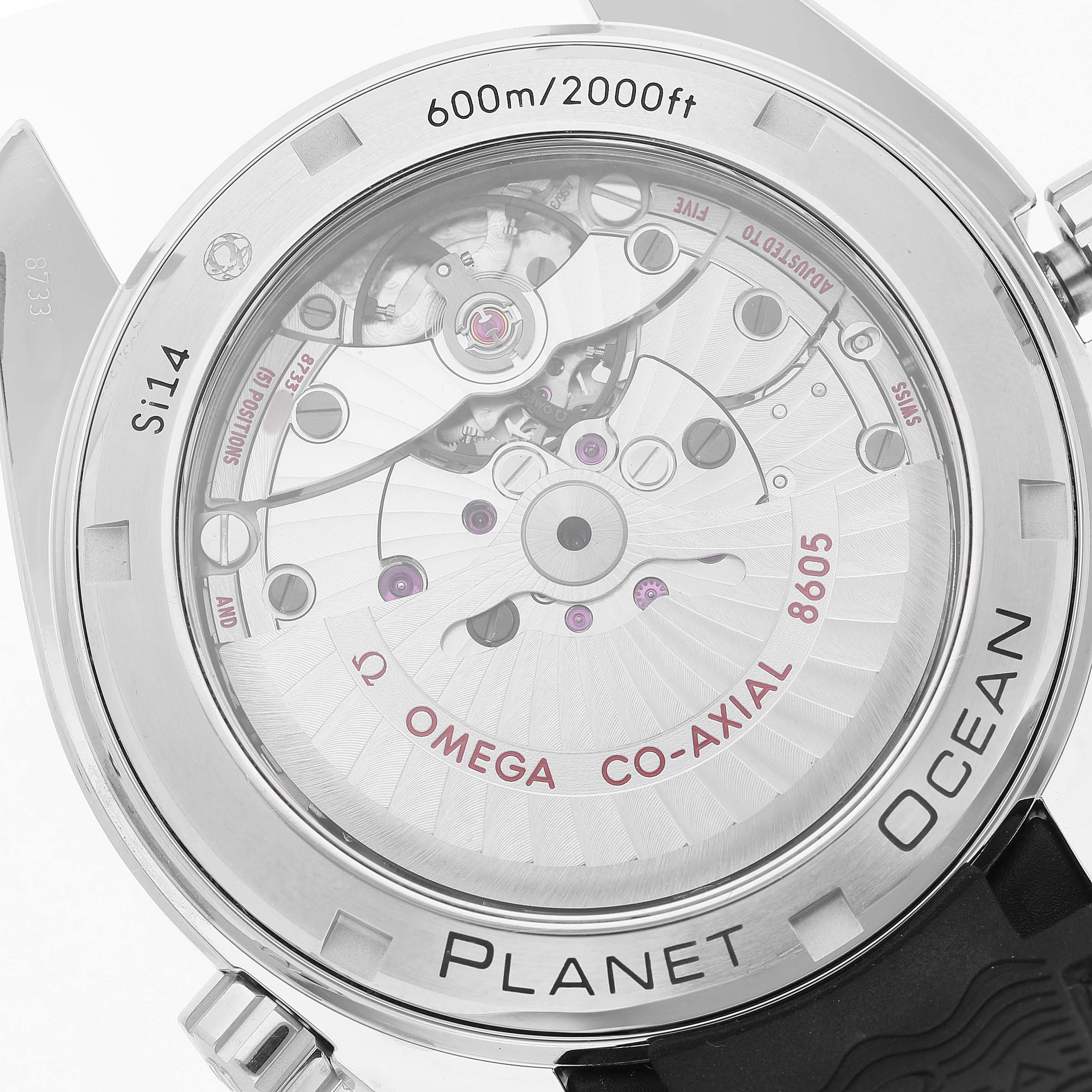 The image shows the case back of the Omega Planet Ocean 232.32.44.22.01.001 Men's Stainless Steel Black Dial, revealing its co-axial movement and engraved specifications.