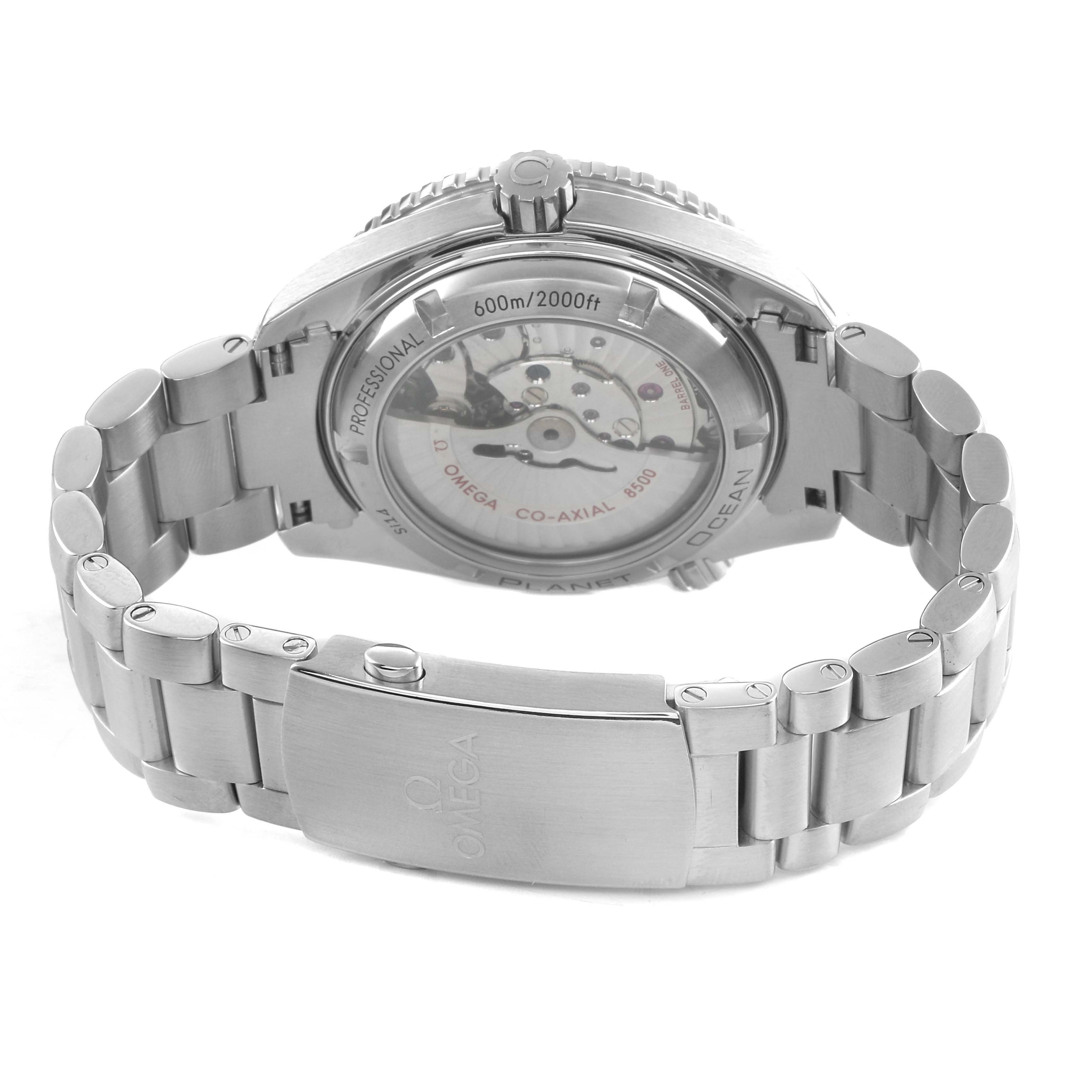 The Omega Seamaster 232.30.42.21.01.001 Men's Stainless Steel Black Dial watch is shown from the back, highlighting the transparent caseback and metal bracelet with clasp.