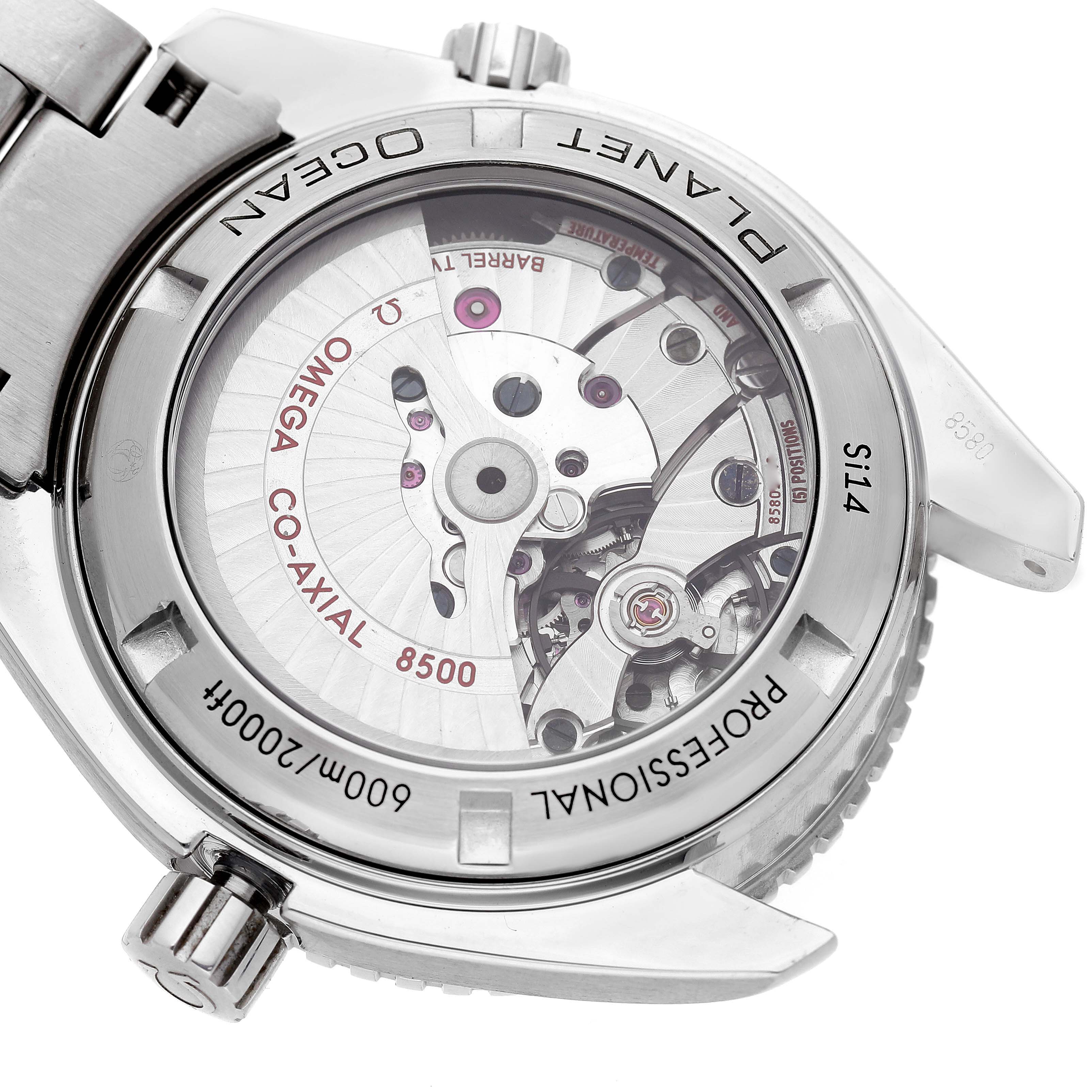 The image shows the back of the Omega Seamaster 232.30.42.21.01.001 Men's Stainless Steel Black Dial, highlighting its mechanical movement and co-axial escapement.