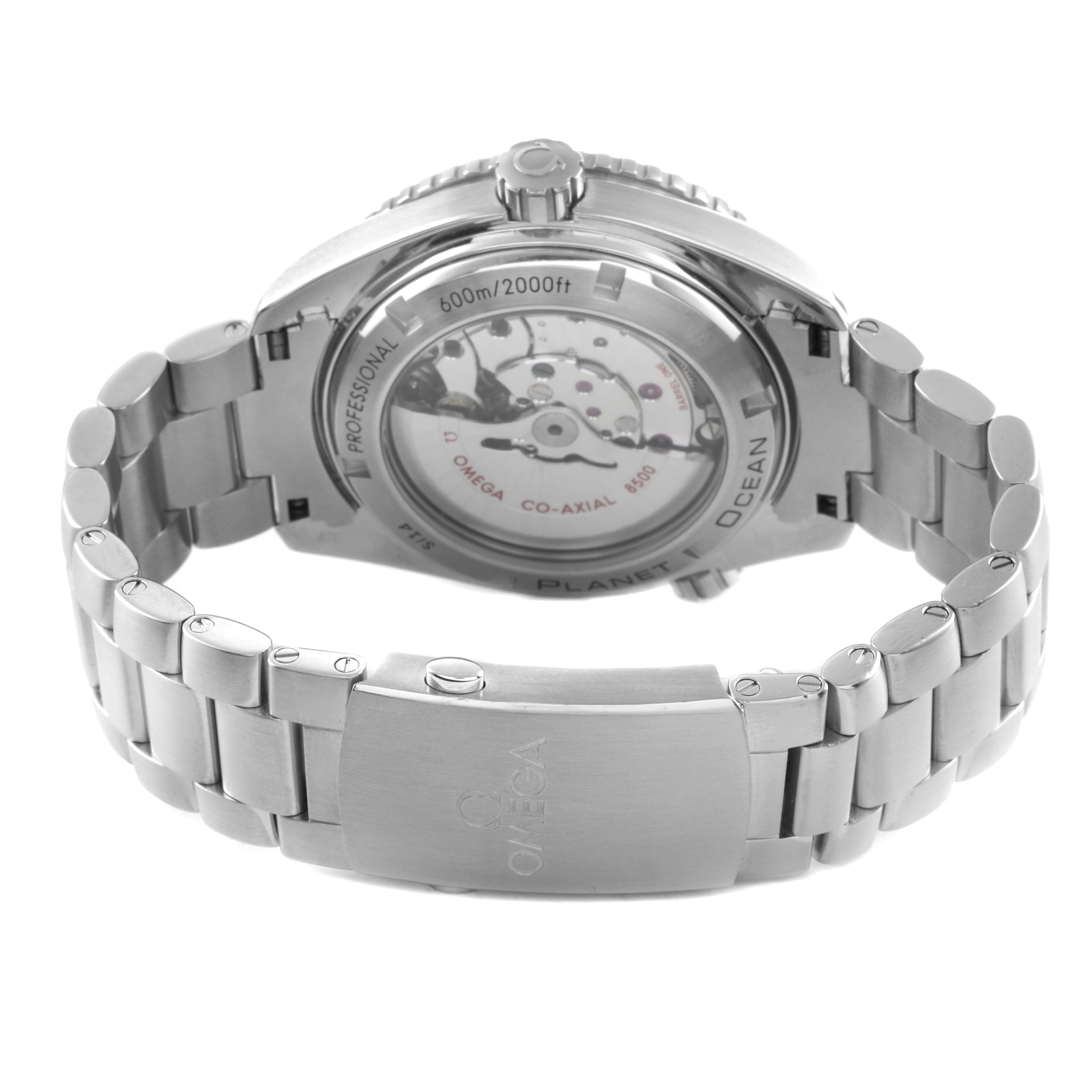 The image shows the back view of the Omega Planet Ocean 232.30.46.21.01.001 Men's Stainless Steel Black Dial, highlighting its transparent case back and bracelet clasp.