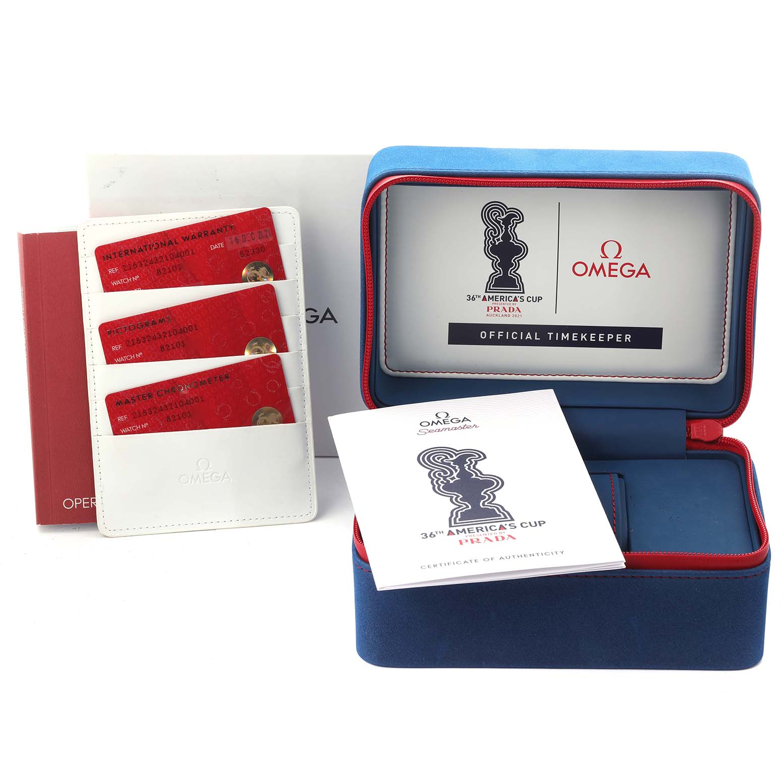 The image shows the Omega Planet Ocean 215.32.43.21.04.001 Men's Stainless Steel White Dial 215.32.43.21.04.001 Men's Stainless Steel White Dial watch accessories, including a box, cards, and manuals from a frontal angle.