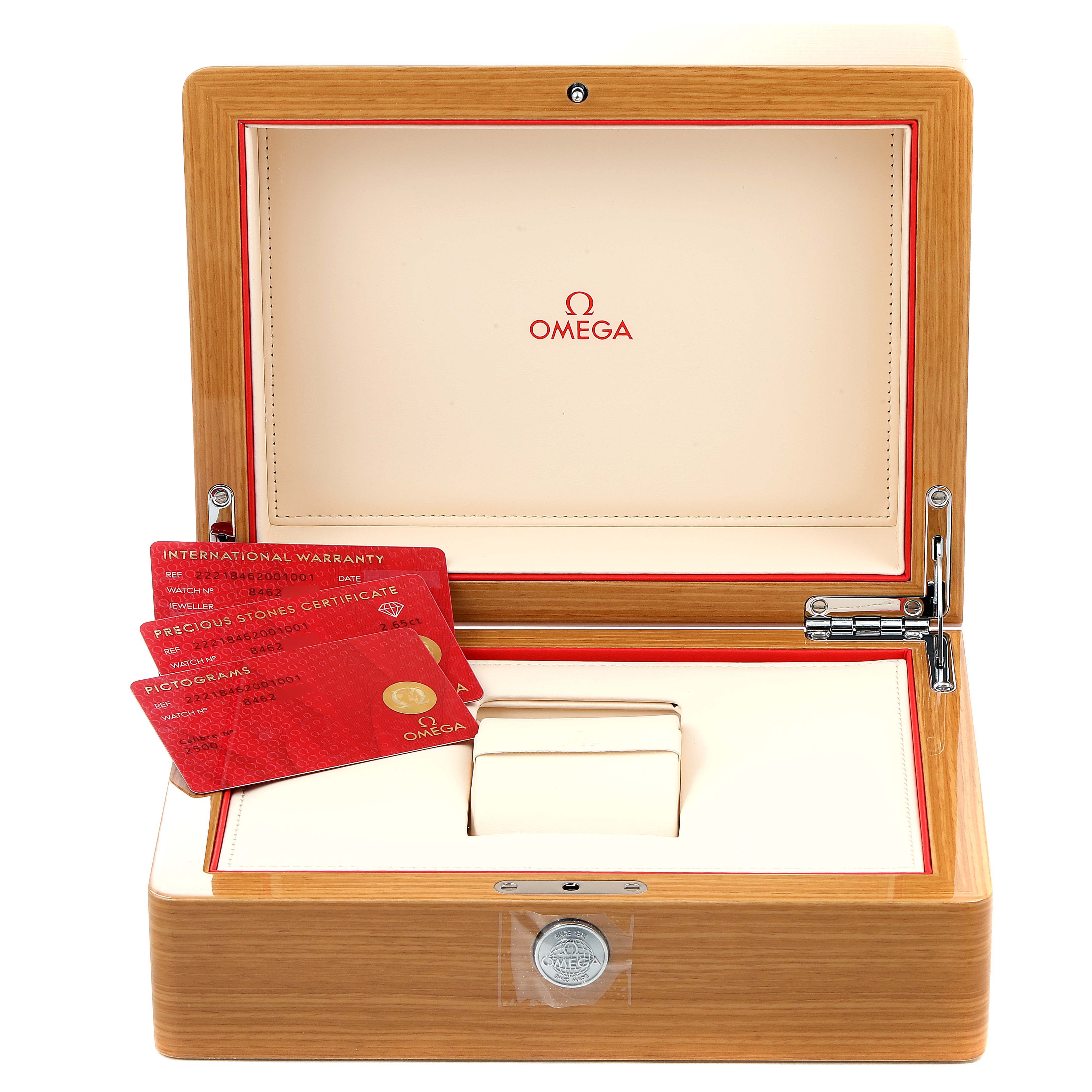 The image shows an open Omega Planet Ocean 222.18.46.20.01.001 Men's Stainless Steel Black Dial 222.18.46.20.01.001 Men's Stainless Steel Black Dial watch box with warranty cards and a cushion for the watch.