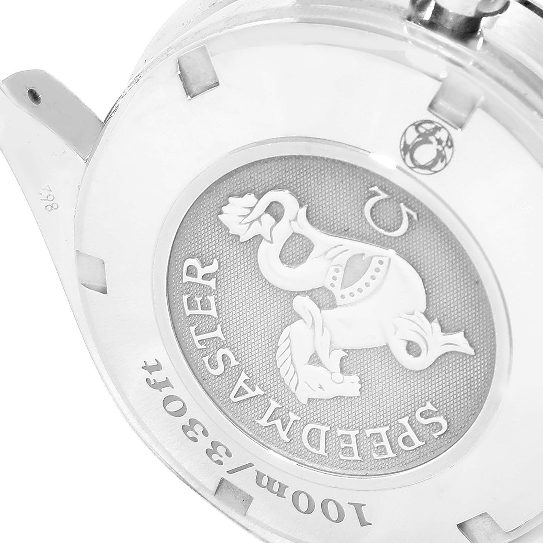 The image shows the caseback of an Omega Speedmaster 3212.80.00 Men
s Stainless Steel Blue Dial 3212.80.00 Men
s Stainless Steel Blue Dial watch, highlighting the engraved branding and design elements.