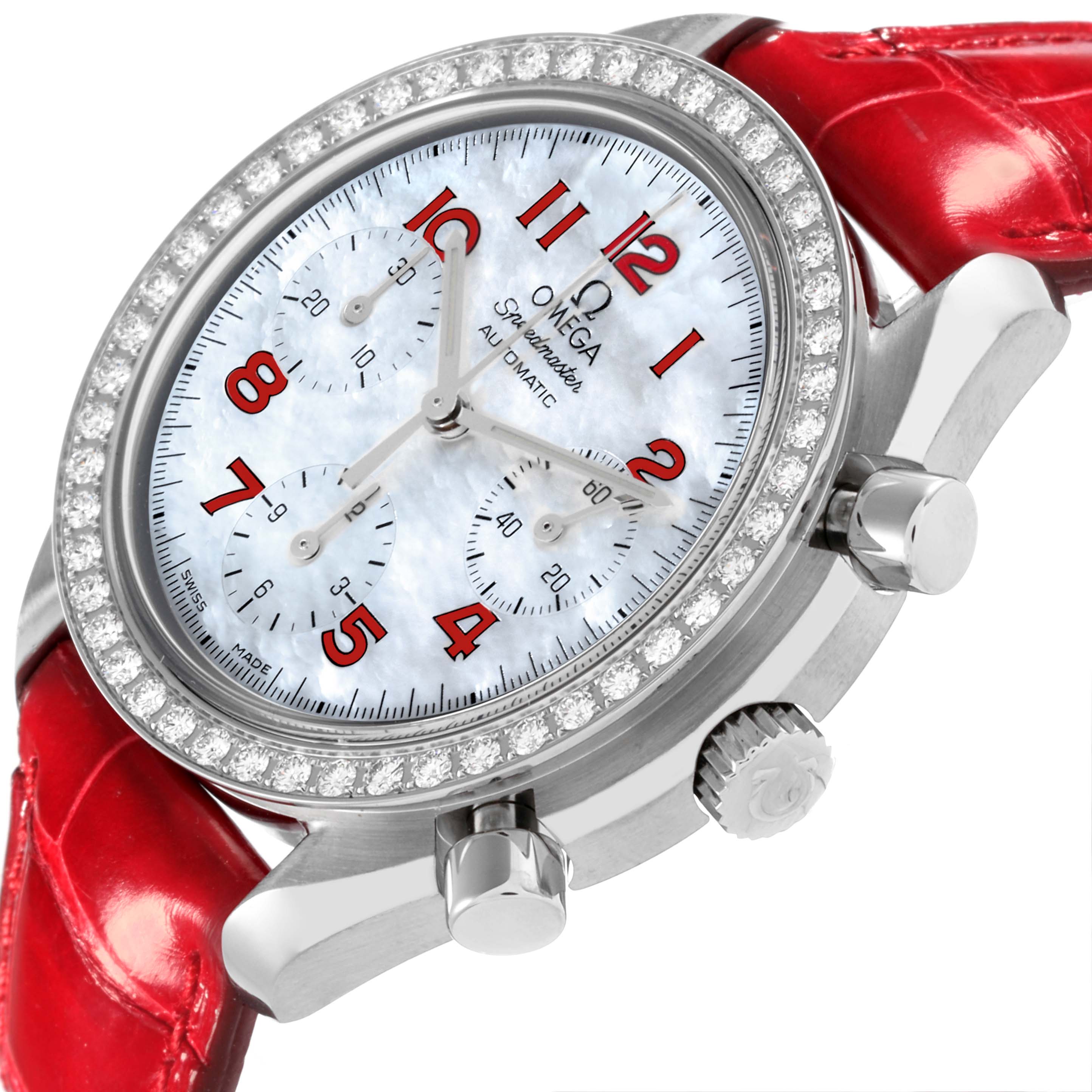 The Omega 3815.79.40 Women's Stainless Steel Mother of Pearl Dial 3815.79.40 Women's Stainless Steel Mother of Pearl Dial Speedmaster MOP Diamond Red Strap Ladies Watch 3815.79.40 is shown at an angle highlighting its diamond bezel, dial, and side pushers.