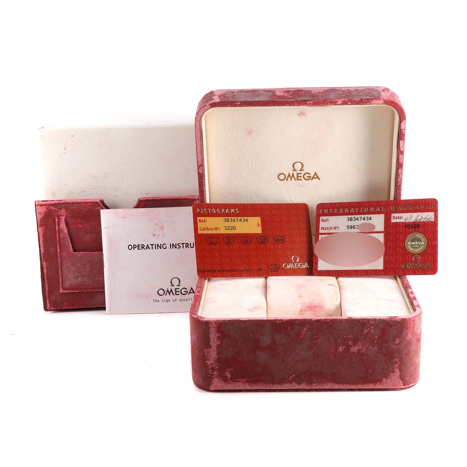 The image shows the open velvet box and warranty cards for an Omega Speedmaster 3834.74.34 Men's Stainless Steel Mother of Pearl Dial 3834.74.34 Men's Stainless Steel Mother of Pearl Dial watch, along with an operating instructions booklet.